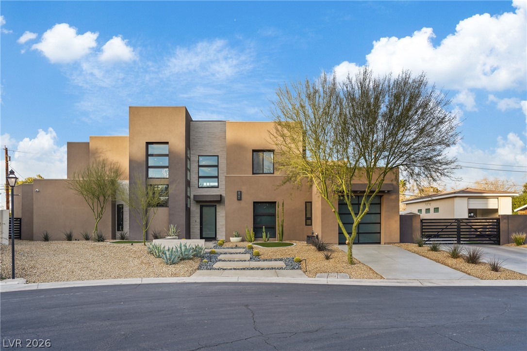 3740 Caesars Circle Las Vegas, NV 89120 - Photo 3 of 89 This modern desert home showcases sleek lines and thoughtful landscaping for striking curb appeal.