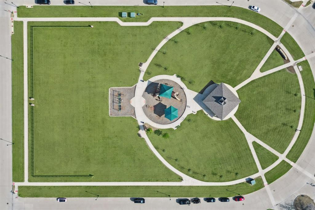 11732 Wulstone Road Fort Worth, TX 76052 - Photo 33 of 34 Expansive green space featuring circular and rectangular lawn areas