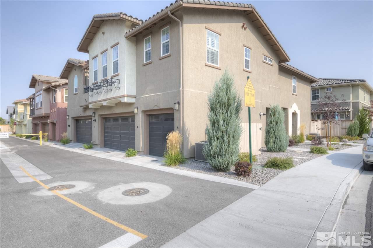 1945 Dark Horse Road, Unit A Reno, NV 89521 - Photo 3 of 27 a front view of a house with a yard and garage