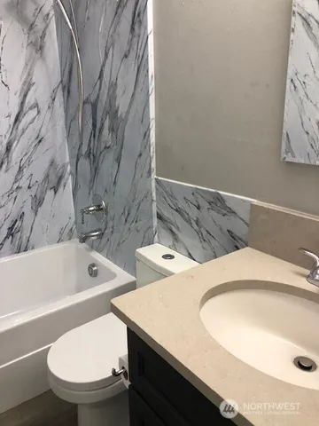 a bathroom with a sink and a toilet