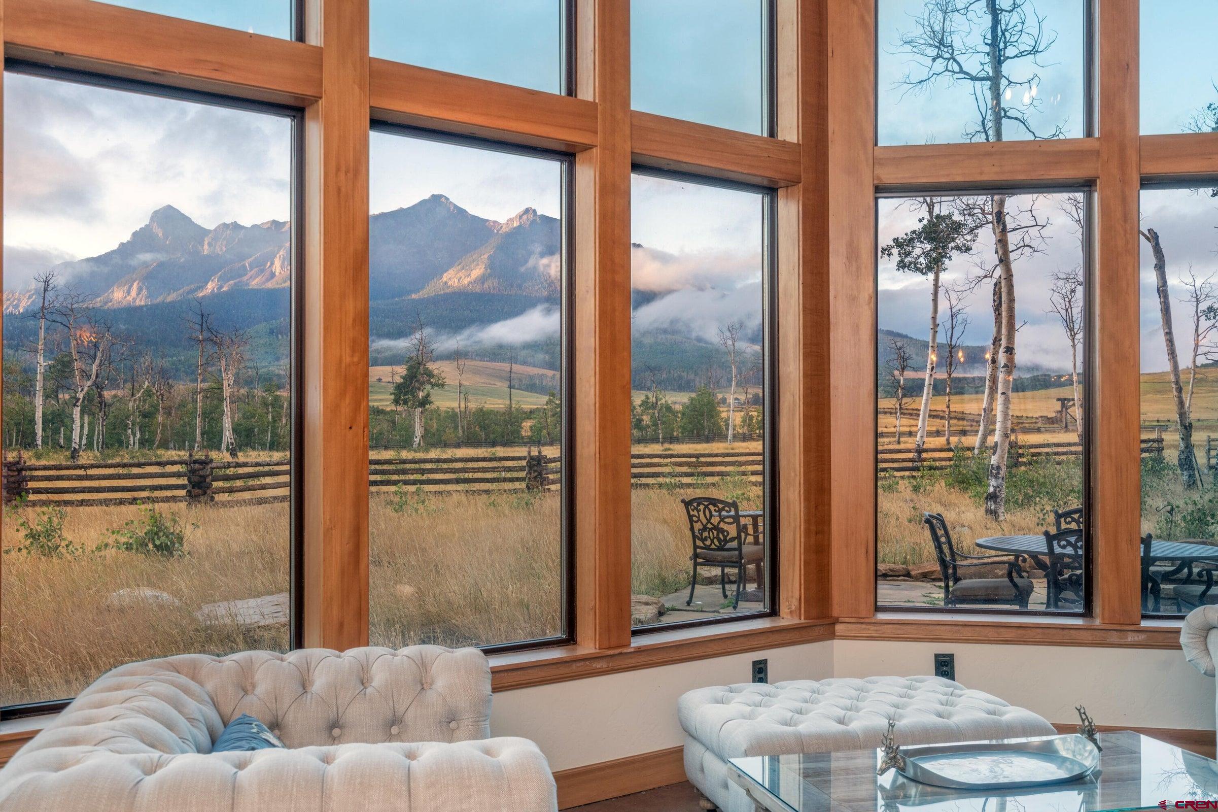 9949-county Rd 58p Placerville, CO 81430 - Photo 5 of 23 a living room with couch and a large window