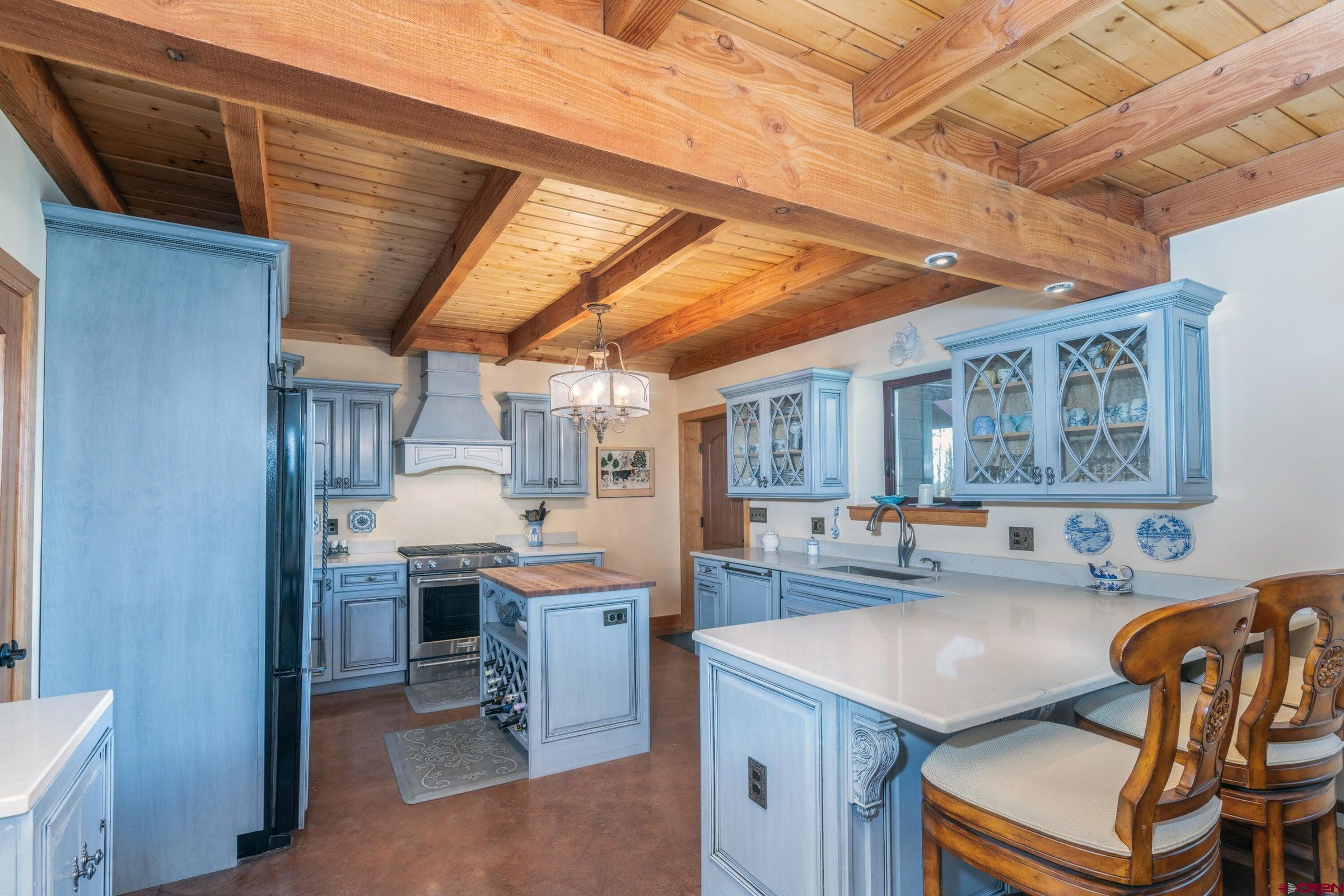 9949-county Rd 58p Placerville, CO 81430 - Photo 7 of 23 a kitchen with a sink a counter space and appliances