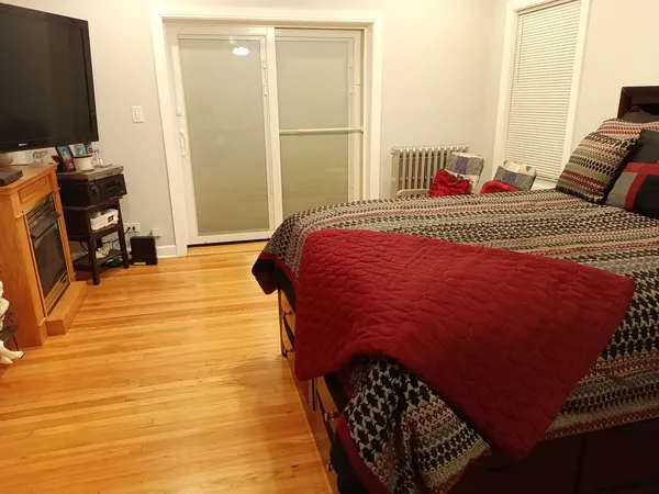 a room with fireplace and wooden floor