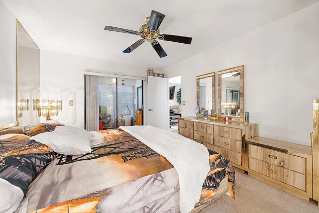 a bed room with a bed and a mirror