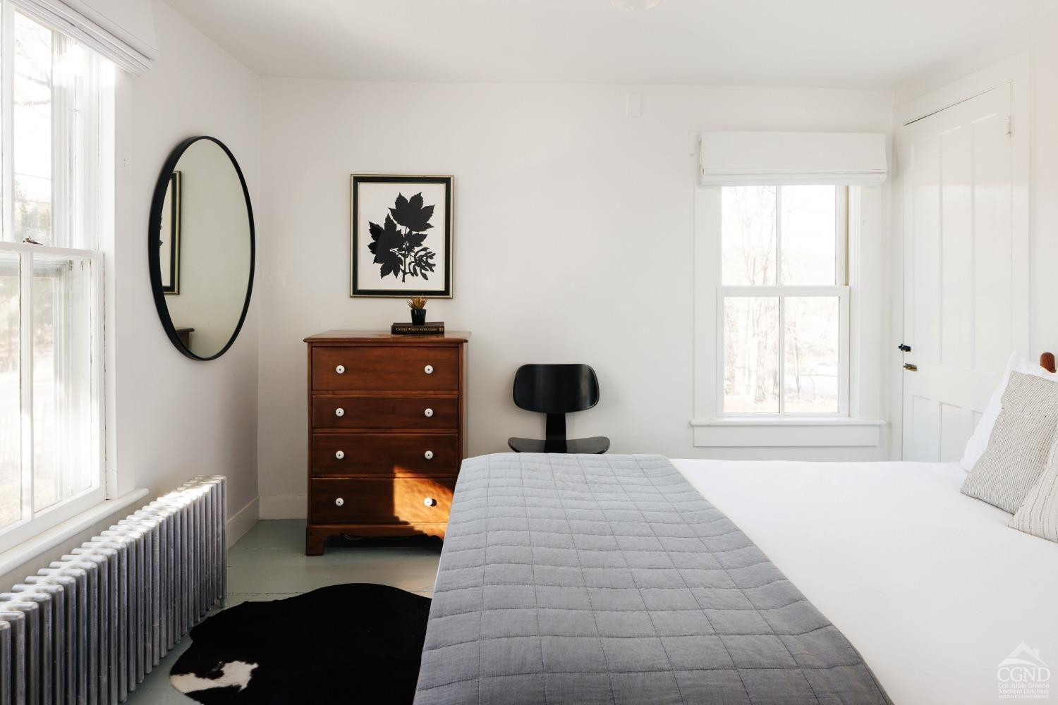720 Center Hill Road Copake, NY 12516 - Photo 8 of 31 a bedroom with a bed and a dresser