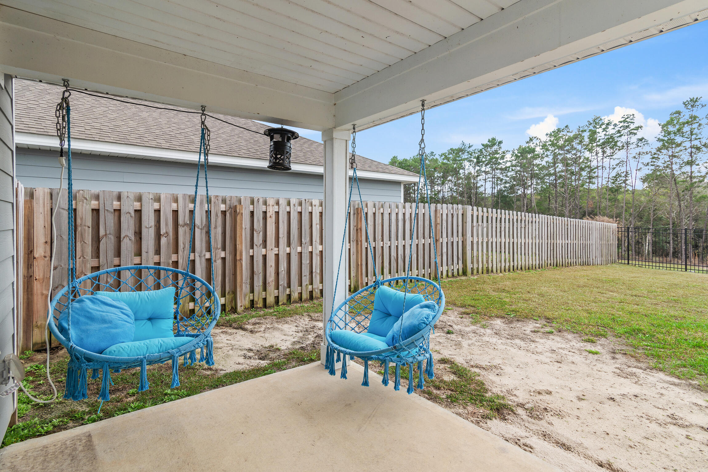 258 This Way, Unit LOT 79 Freeport, FL 32439 - Photo 12 of 80 a backyard of a house with table and chairs
