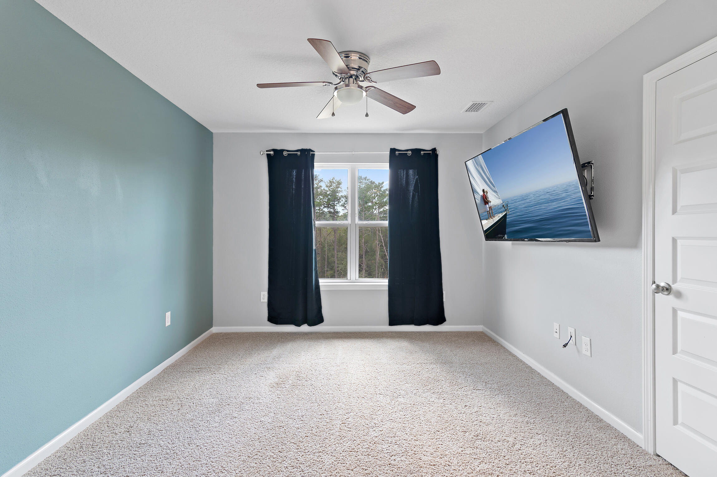 258 This Way, Unit LOT 79 Freeport, FL 32439 - Photo 19 of 80 a view of a livingroom with a ceiling fan and window