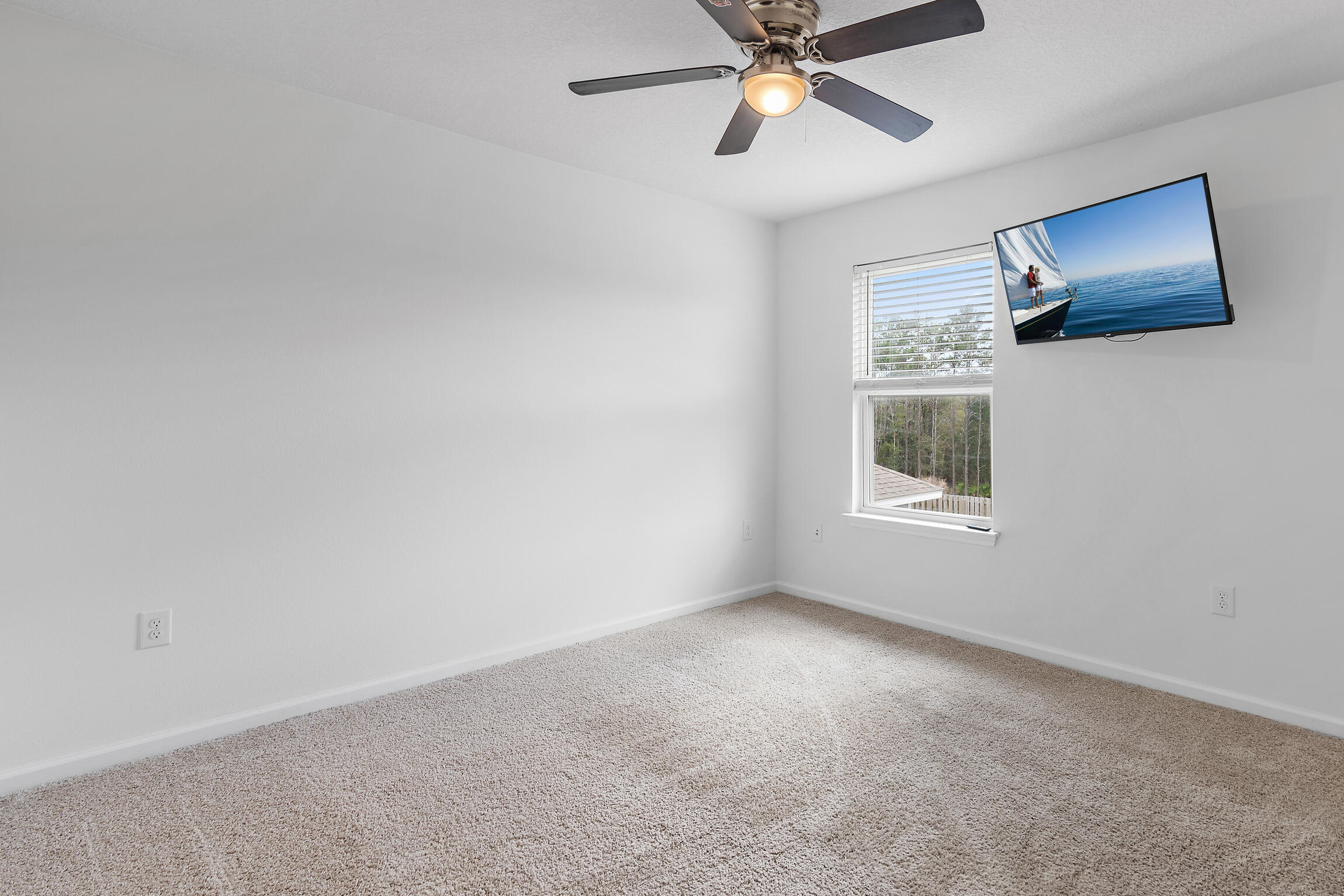 258 This Way, Unit LOT 79 Freeport, FL 32439 - Photo 27 of 80 a view of a livingroom with a ceiling fan and window