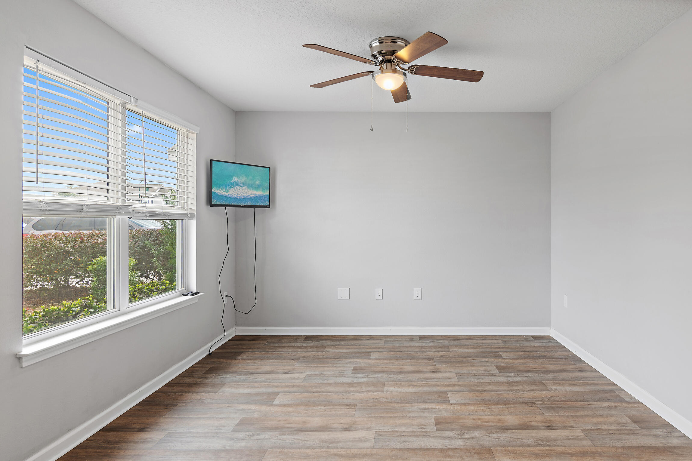 258 This Way, Unit LOT 79 Freeport, FL 32439 - Photo 3 of 80 an empty room with wooden floor and windows