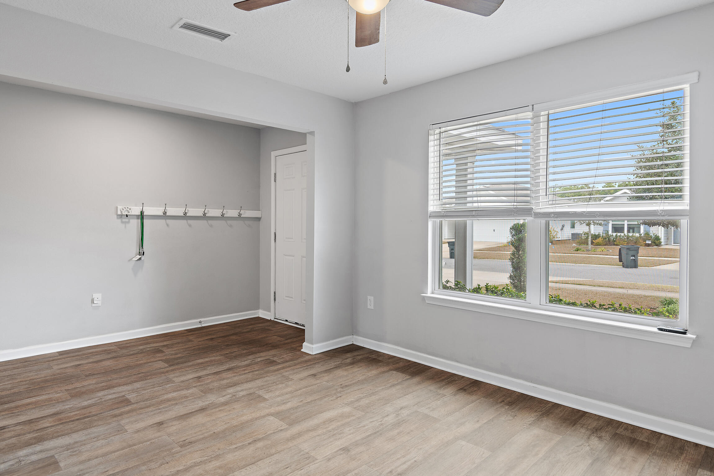 258 This Way, Unit LOT 79 Freeport, FL 32439 - Photo 4 of 80 a view of an empty room with wooden floor and a window
