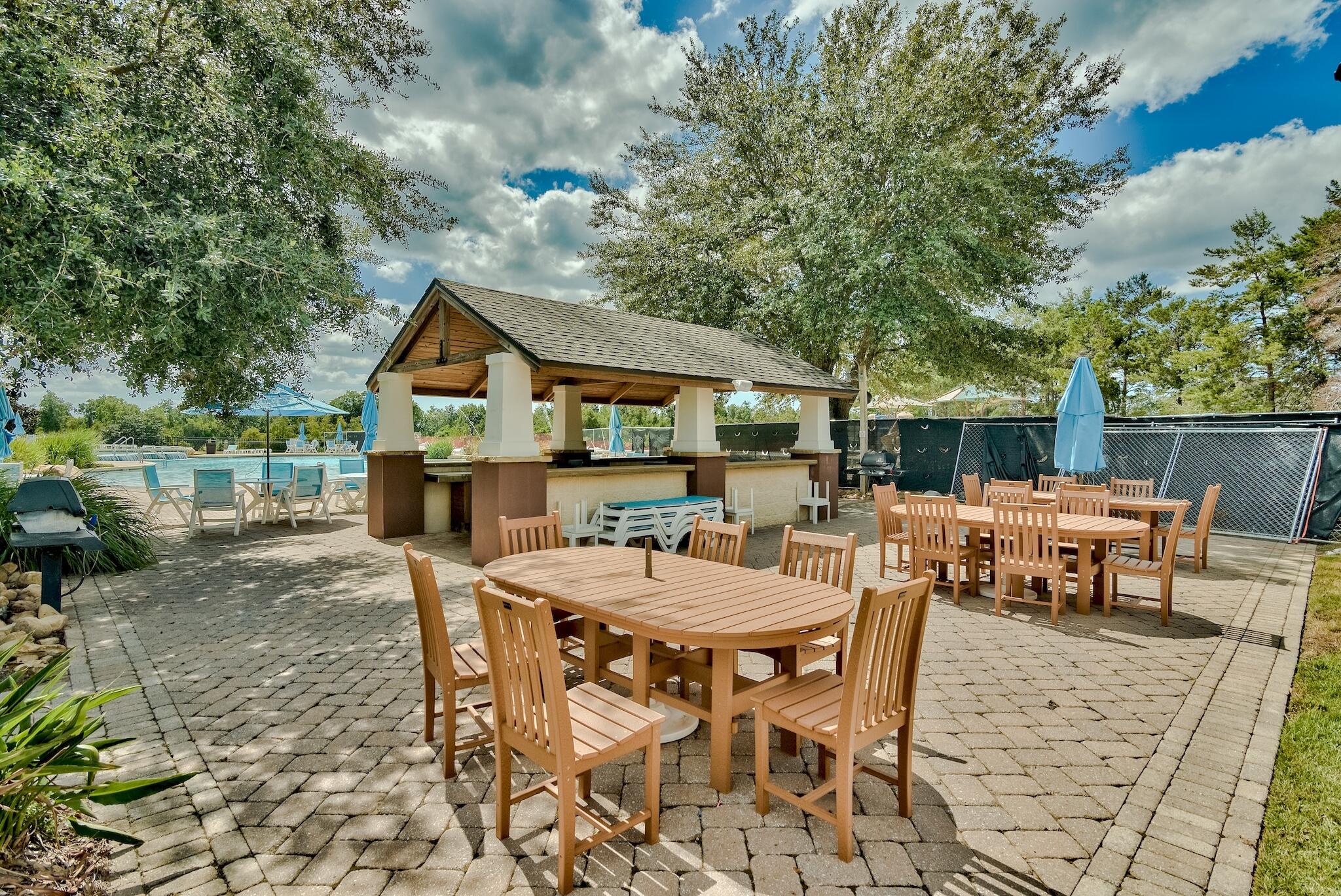 258 This Way, Unit LOT 79 Freeport, FL 32439 - Photo 49 of 80 a view of a dinning table and chairs in the patio