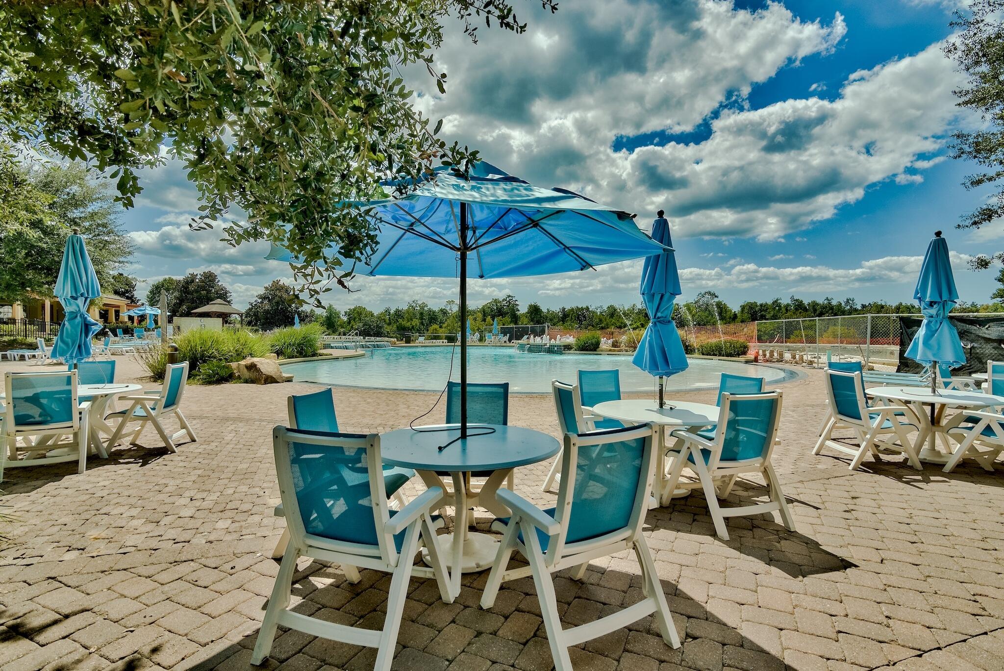 258 This Way, Unit LOT 79 Freeport, FL 32439 - Photo 50 of 80 a view of a tables and chairs under an umbrella