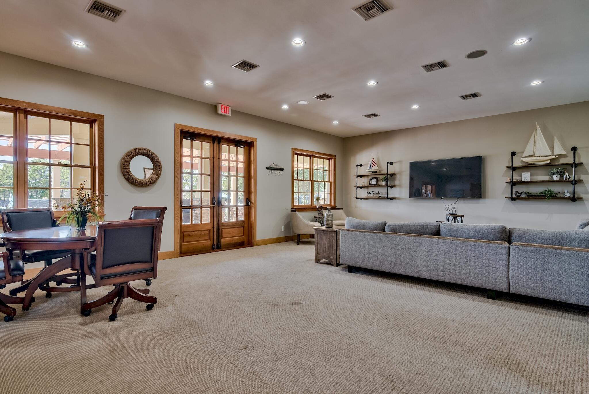 258 This Way, Unit LOT 79 Freeport, FL 32439 - Photo 68 of 80 a living room with furniture and a flat screen tv