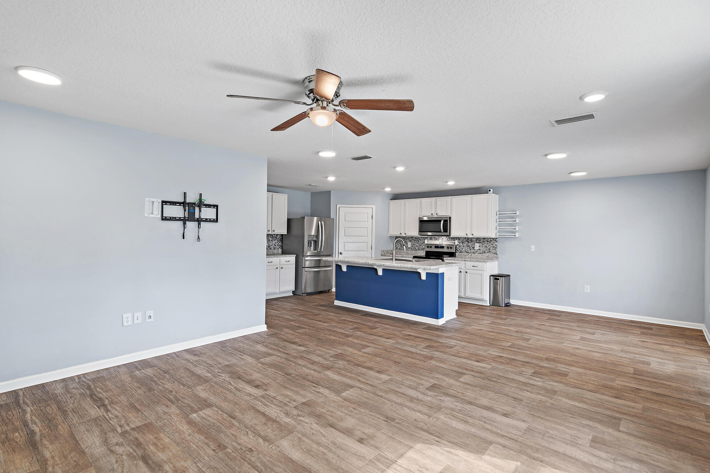 258 This Way, Unit LOT 79 Freeport, FL 32439 - Photo 10 of 80 a kitchen with stainless steel appliances kitchen island a refrigerator and a sink