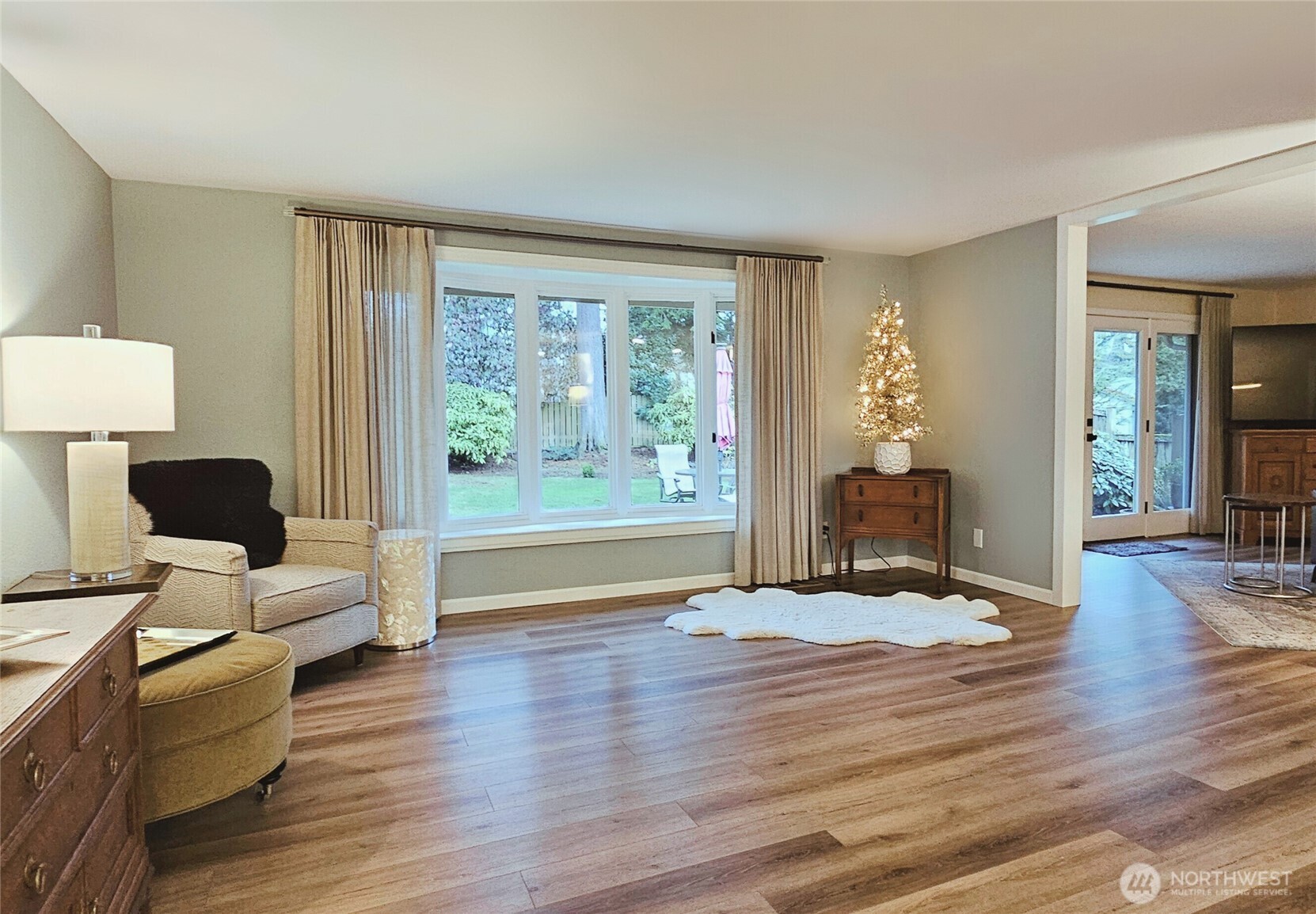 2625 Southwest 320th Place Federal Way, WA 98023 - Photo 16 of 39 a view of a livingroom with furniture a ceiling fan and wooden floor