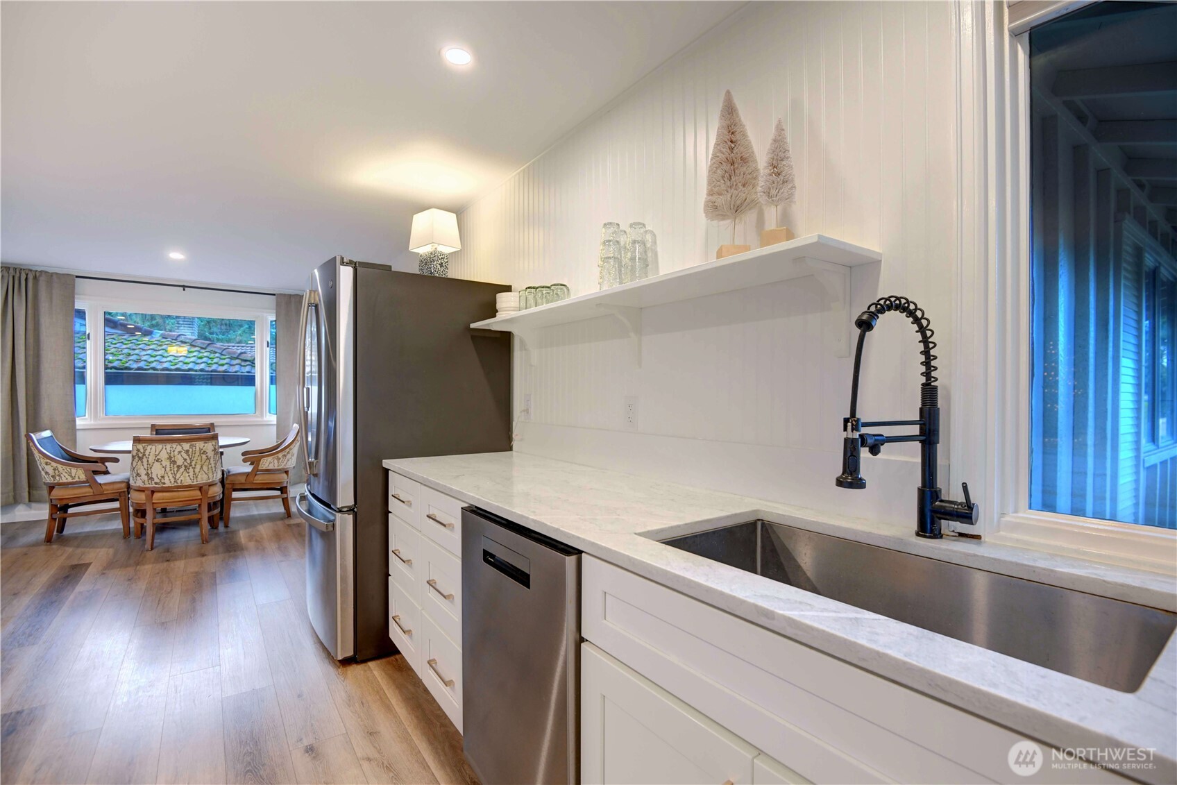 2625 Southwest 320th Place Federal Way, WA 98023 - Photo 8 of 39 a kitchen with a refrigerator sink and wooden floor