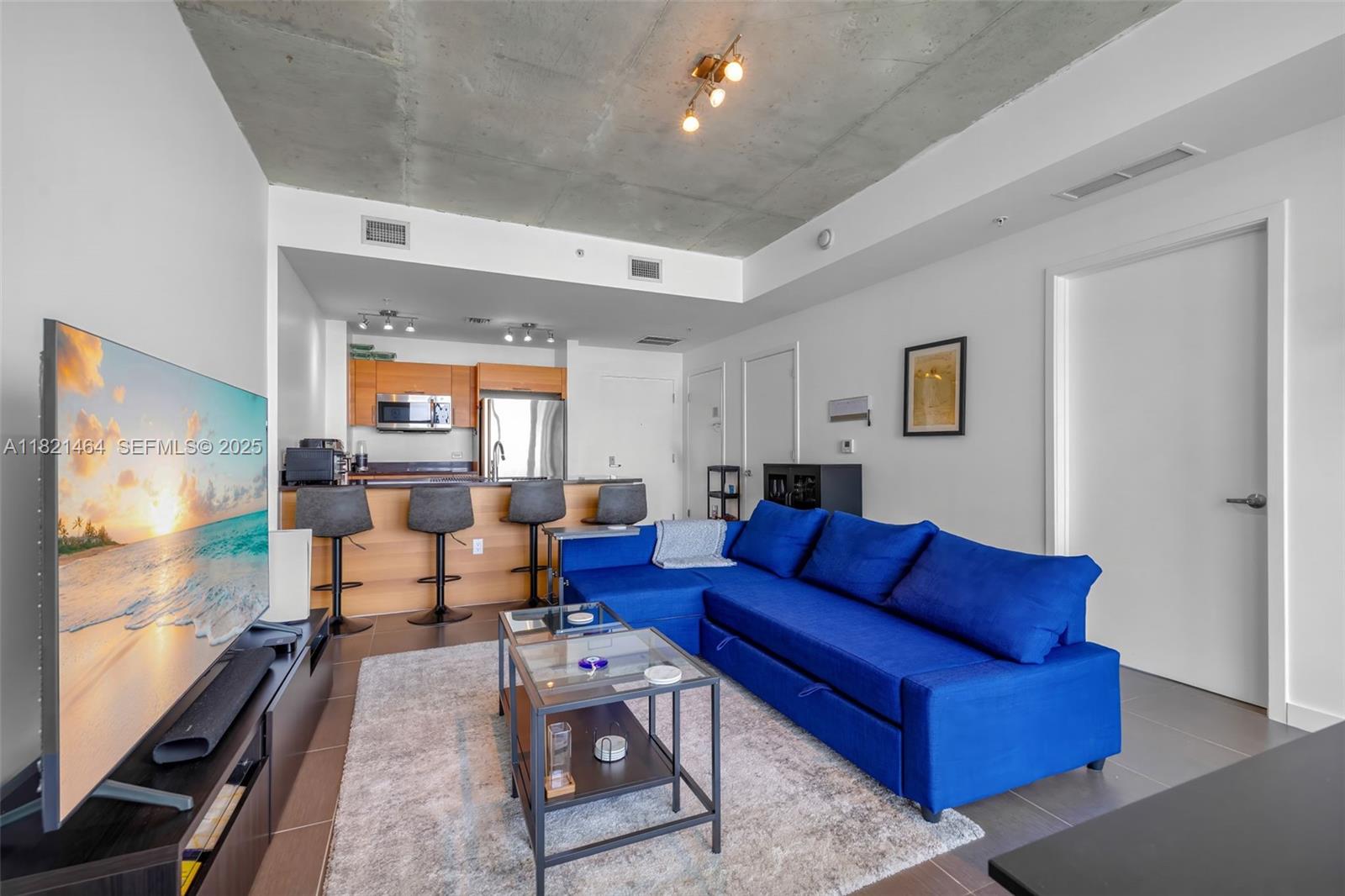 Midtown Miami Miami, FL 33137 - Photo 3 of 17 a living room with furniture kitchen view and a window