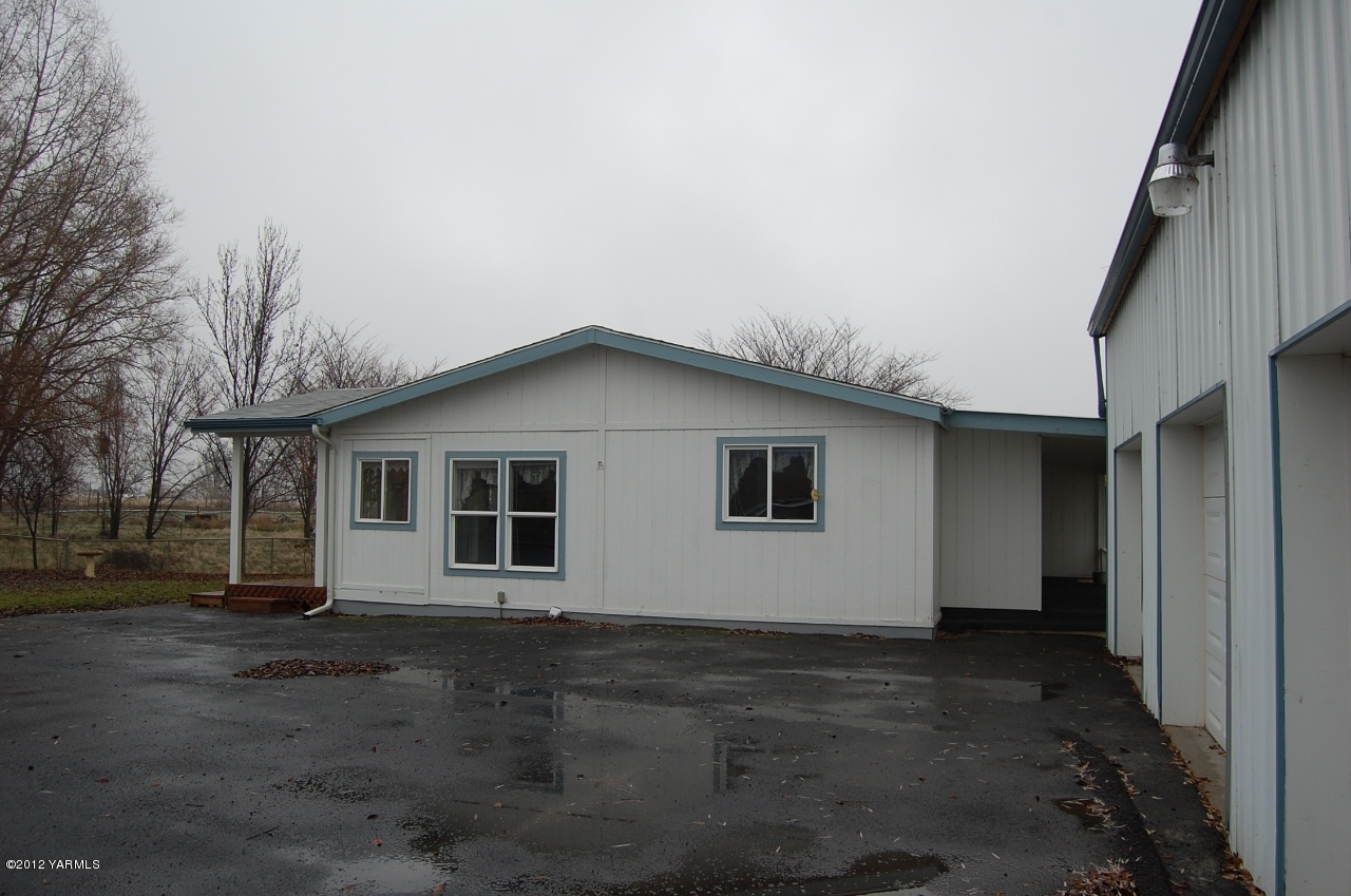 9614 Mieras Road Yakima, WA 98901 - Photo 10 of 13 a house with trees in front of it
