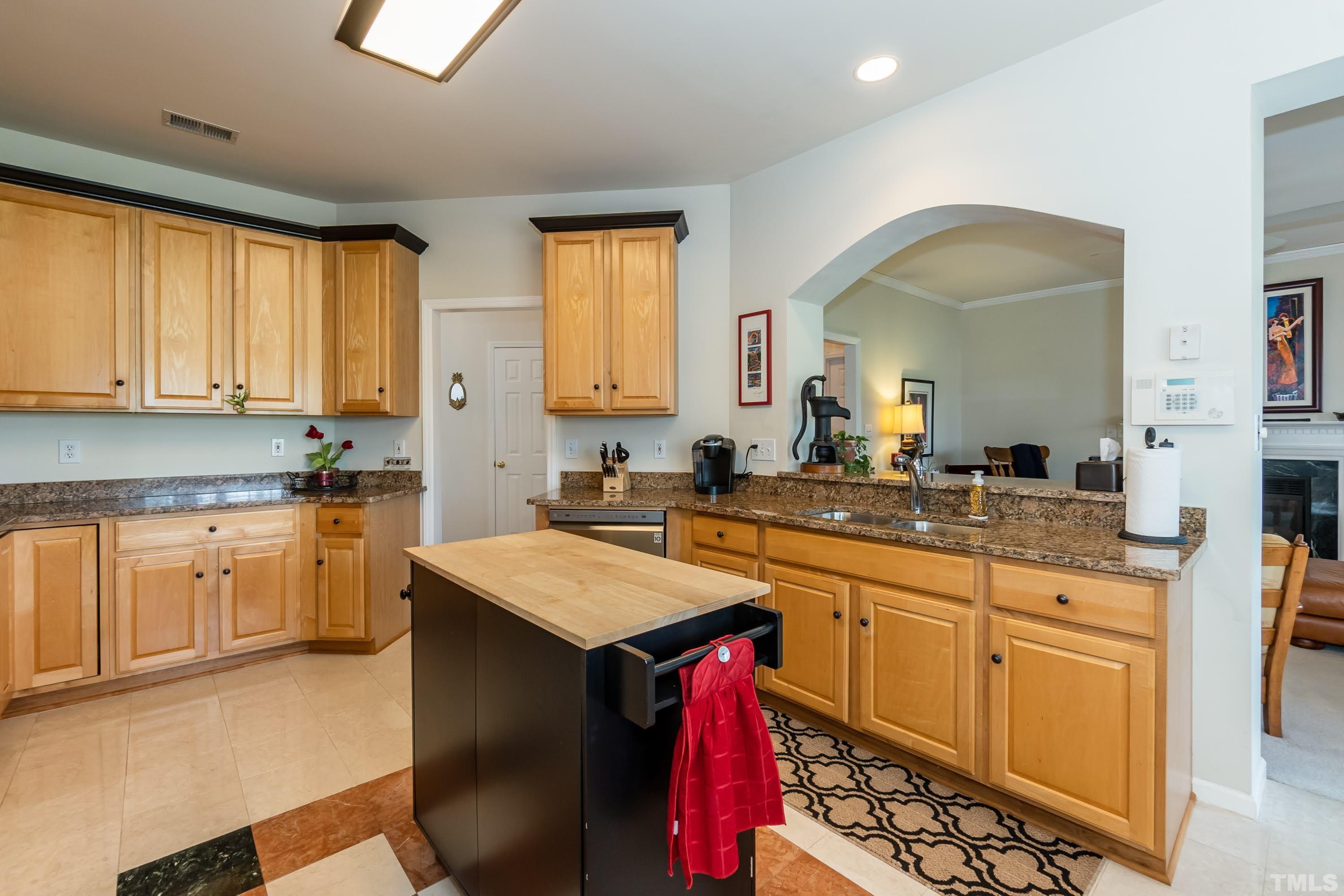 342 Seastone Street Raleigh, NC 27603 - Photo 12 of 50 a kitchen with a sink stove and cabinets