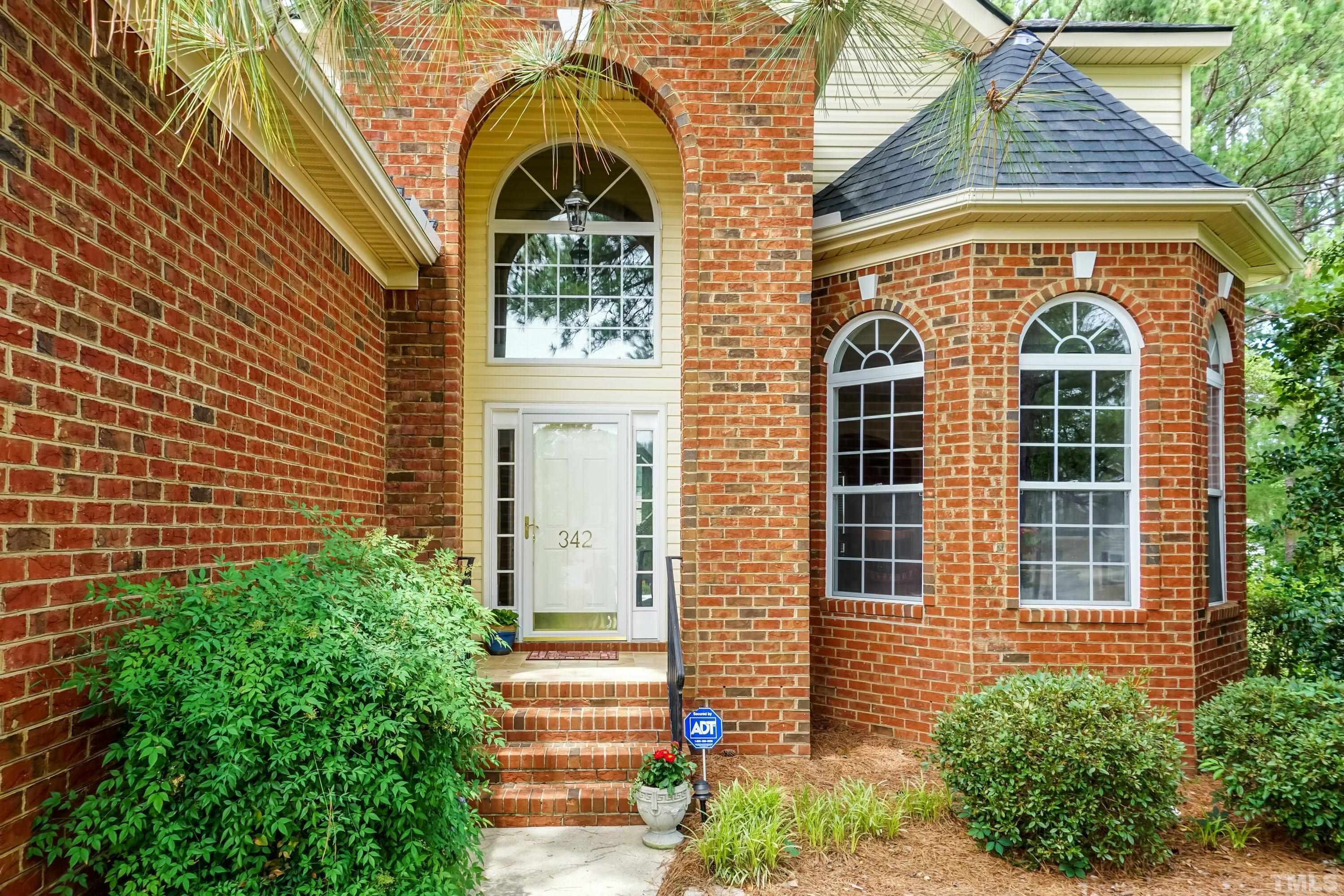 342 Seastone Street Raleigh, NC 27603 - Photo 2 of 50 a view of a brick house with large windows