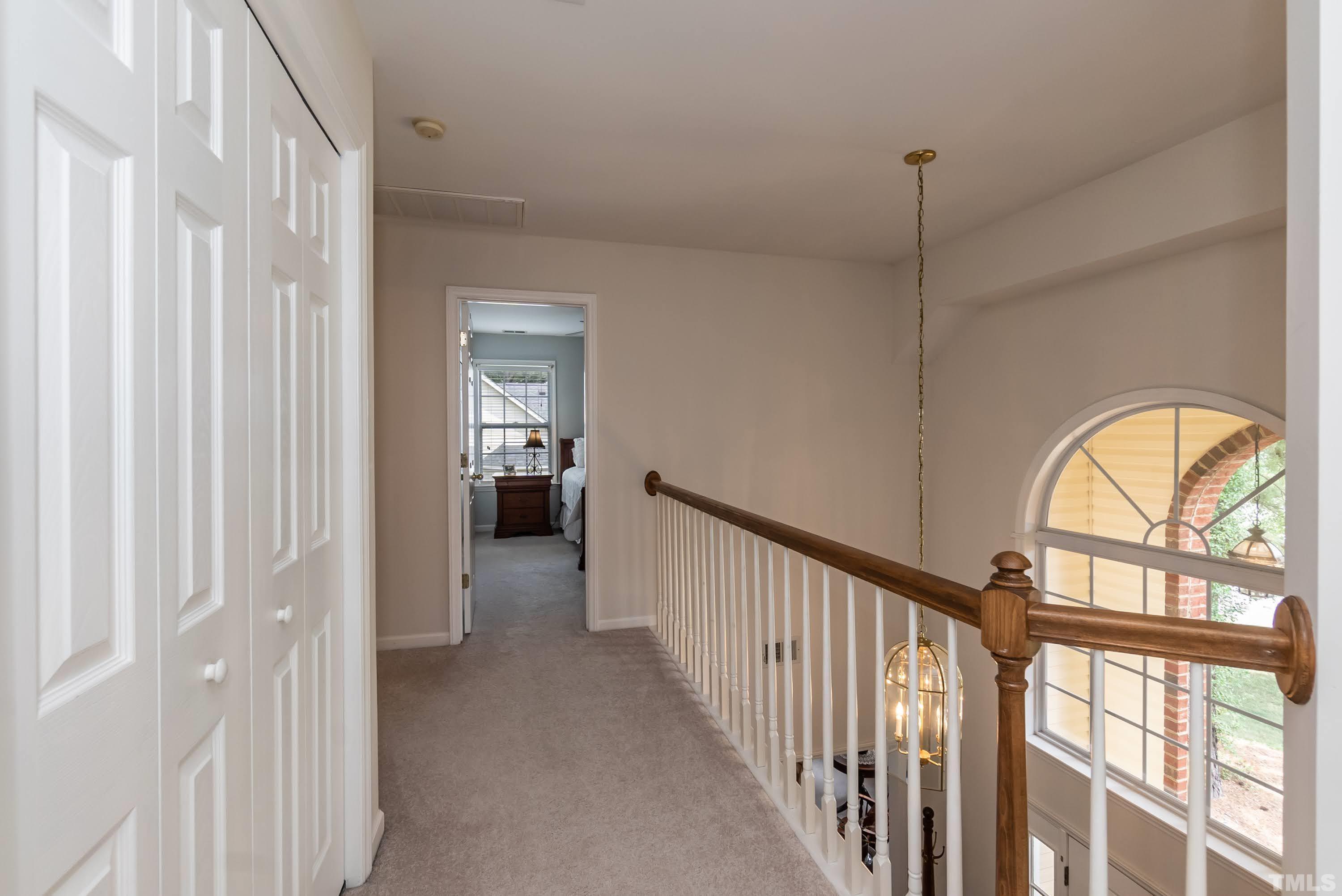 342 Seastone Street Raleigh, NC 27603 - Photo 21 of 50 a view of empty room with wooden floor and windows