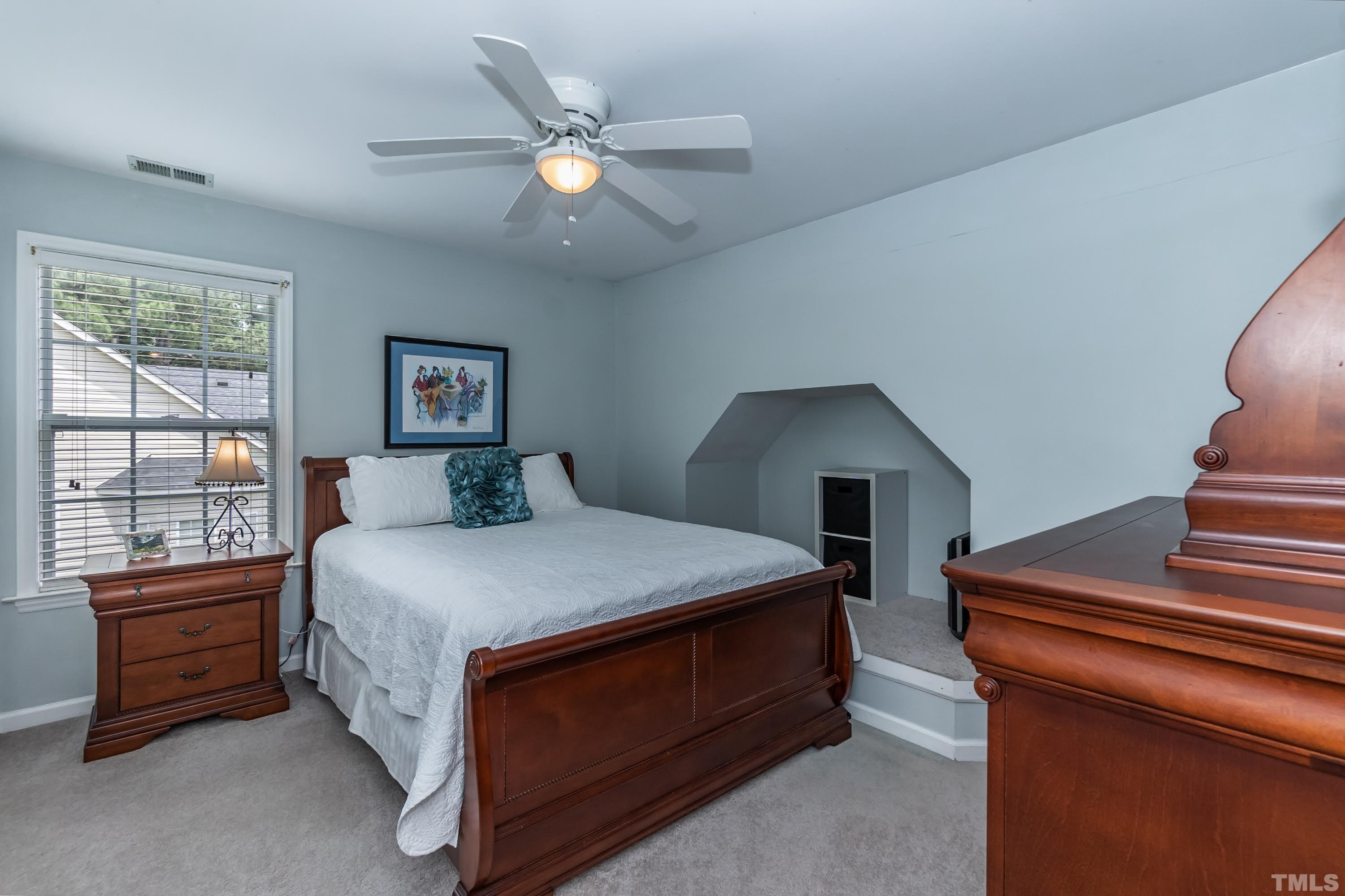 342 Seastone Street Raleigh, NC 27603 - Photo 30 of 50 a bedroom with a bed and a window