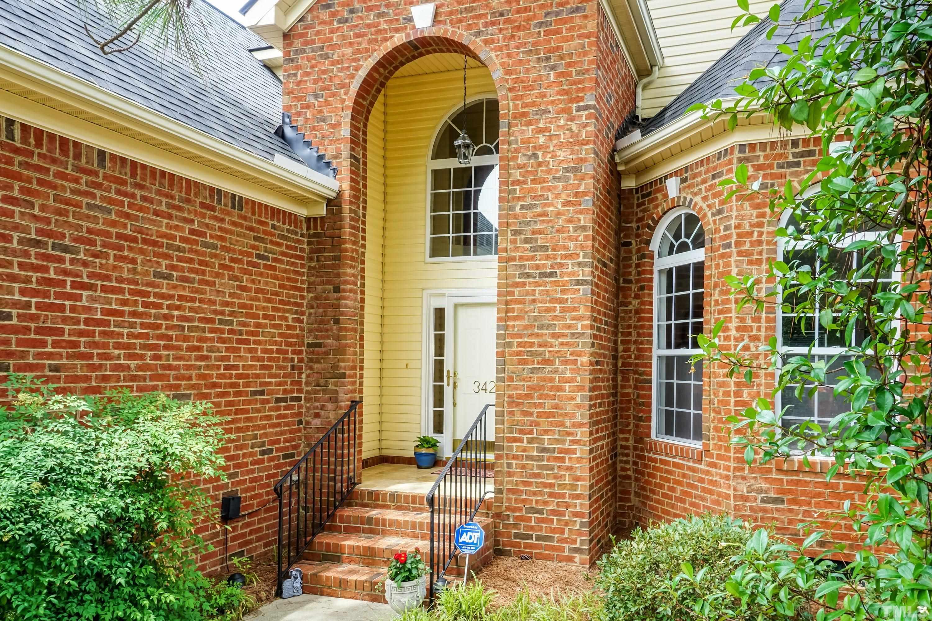 342 Seastone Street Raleigh, NC 27603 - Photo 3 of 50 a view of a brick house with plants