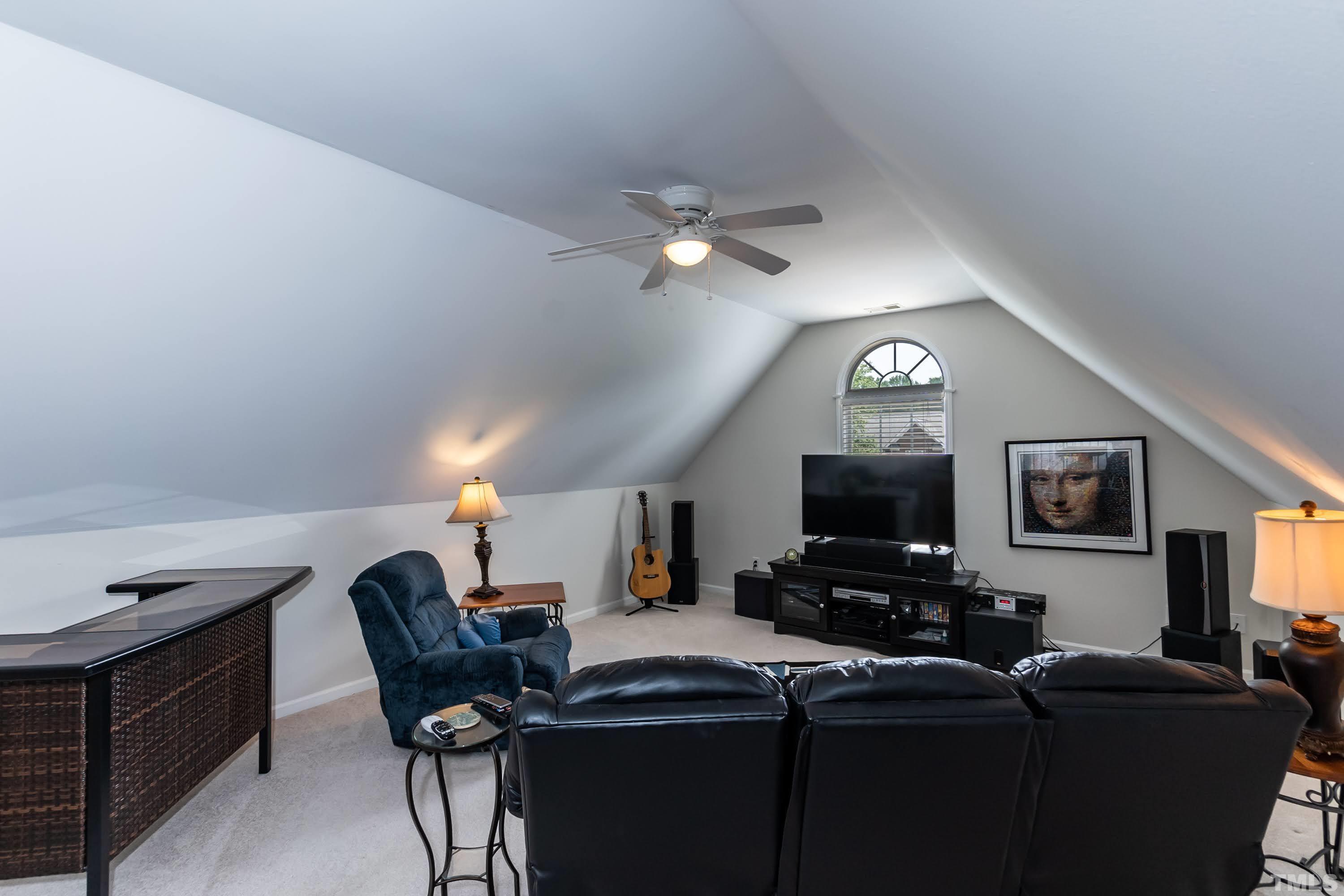 342 Seastone Street Raleigh, NC 27603 - Photo 34 of 50 a view of a livingroom with furniture and a flat screen tv