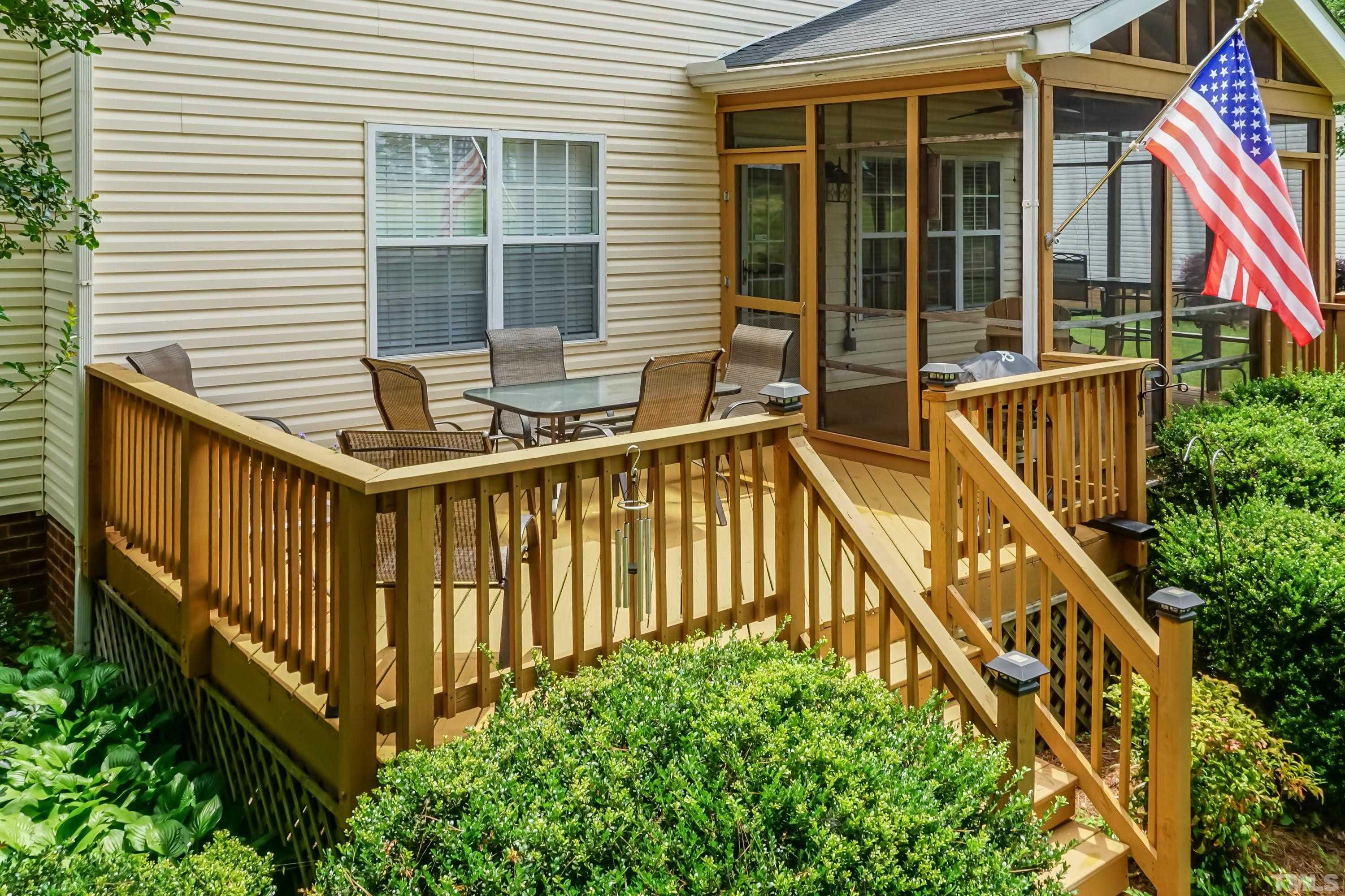 342 Seastone Street Raleigh, NC 27603 - Photo 38 of 50 a view of a house with backyard and deck