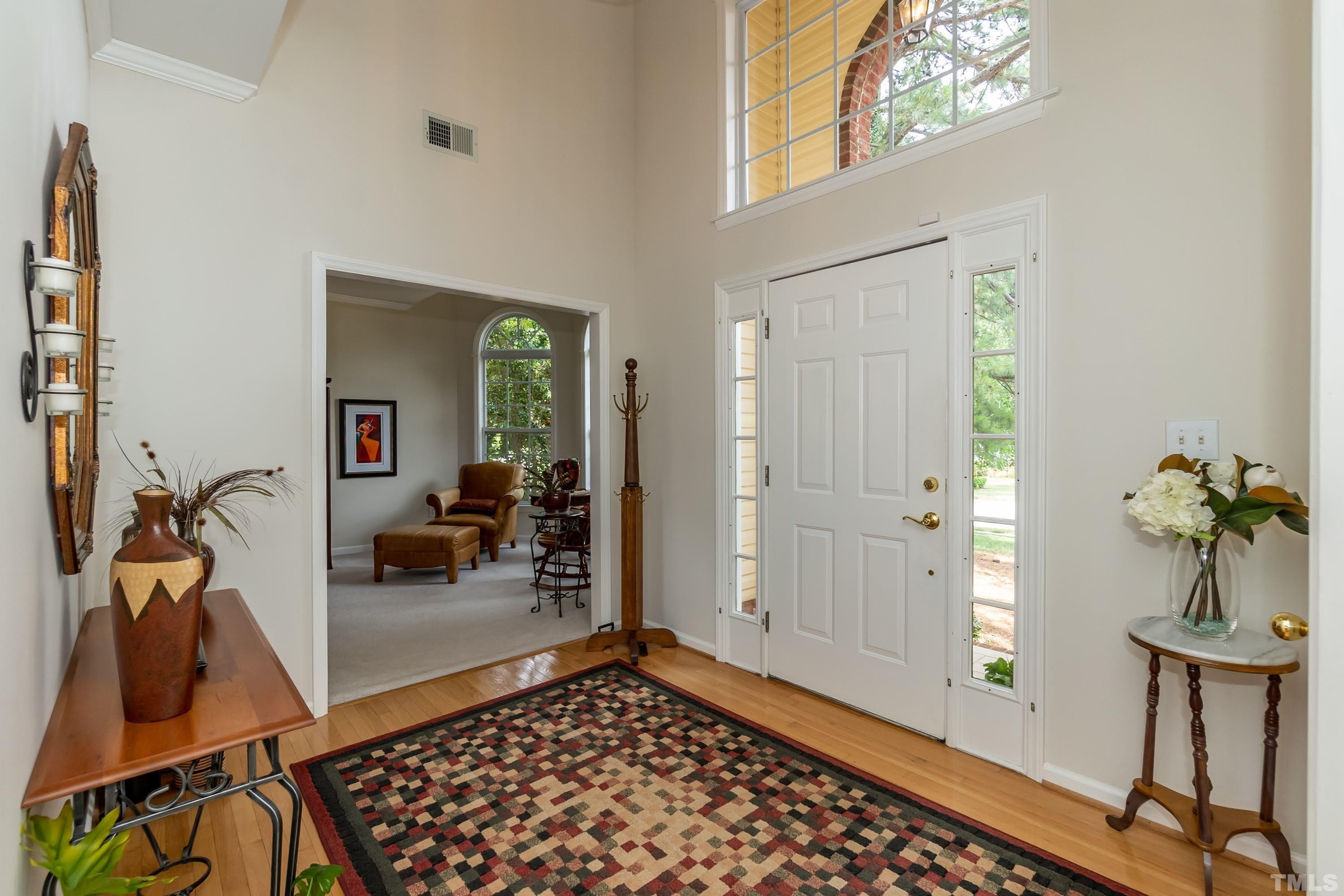 342 Seastone Street Raleigh, NC 27603 - Photo 4 of 50 a room with wooden floor and furniture