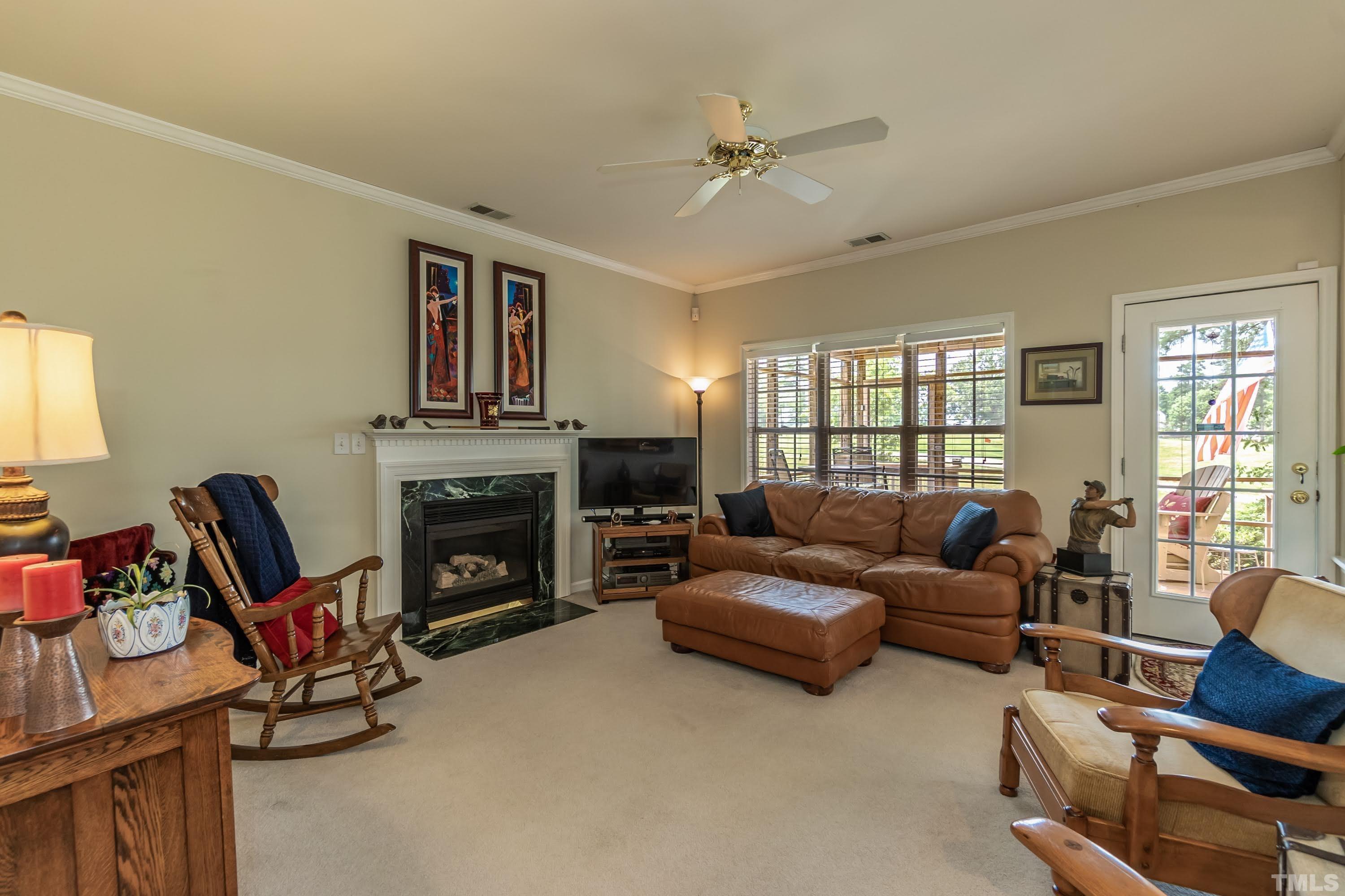 342 Seastone Street Raleigh, NC 27603 - Photo 6 of 50 a living room with furniture and a fireplace