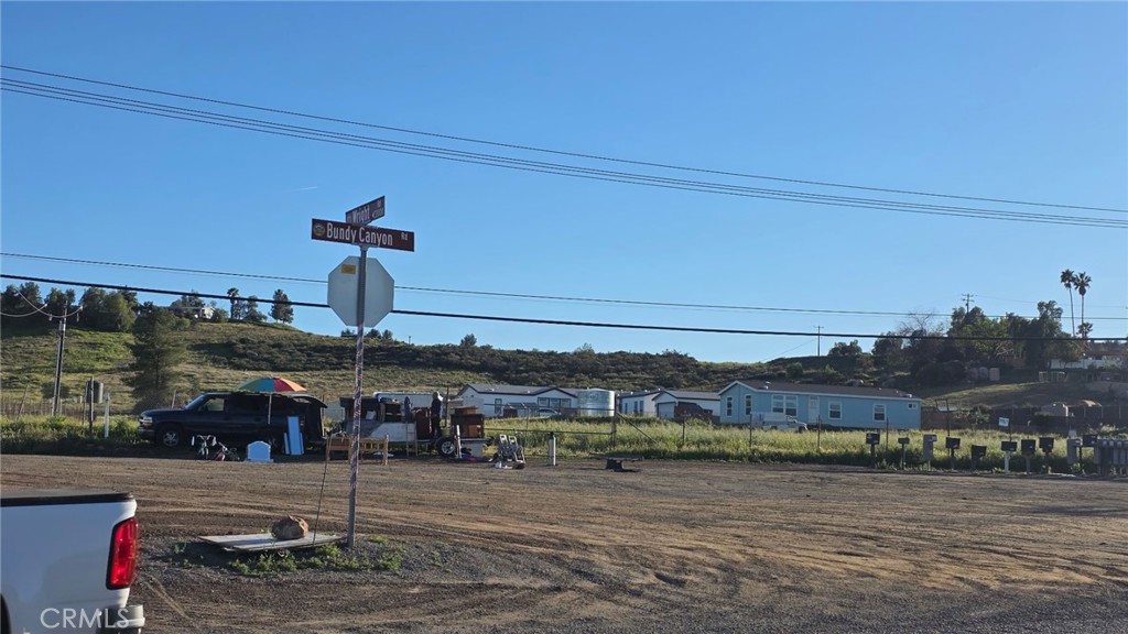 25390 Bundy Canyon Road Menifee, CA 92584 - Photo 6 of 10 a front view of a building with lake view