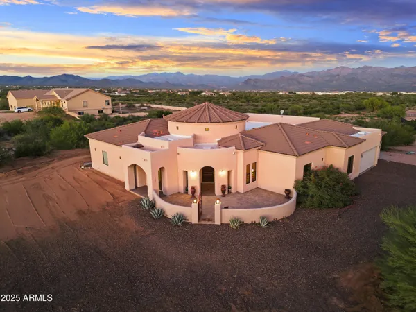 an aerial view of a house with a garden