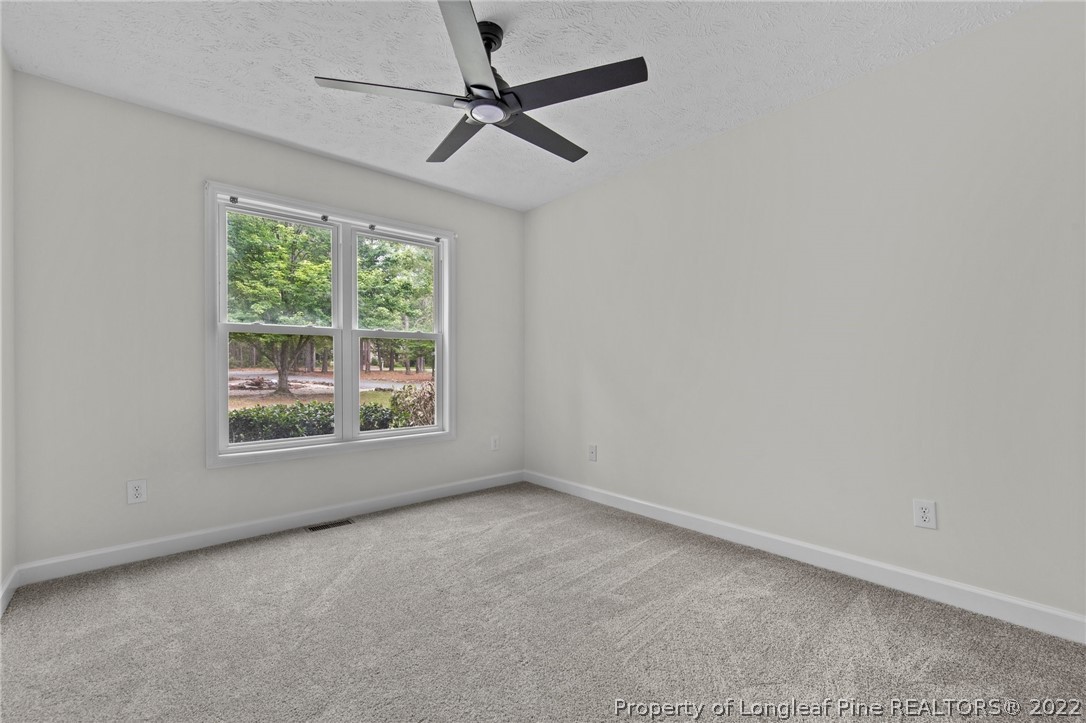 30420 East Lake Road Wagram, NC 28396 - Photo 14 of 35 an empty room with a window