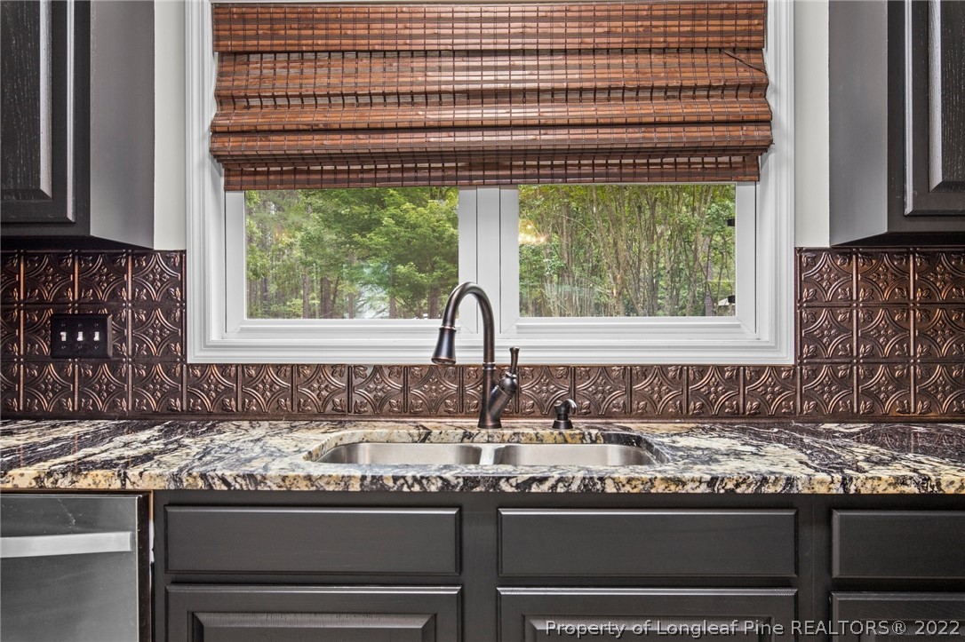 30420 East Lake Road Wagram, NC 28396 - Photo 27 of 35 a kitchen with a sink and a window