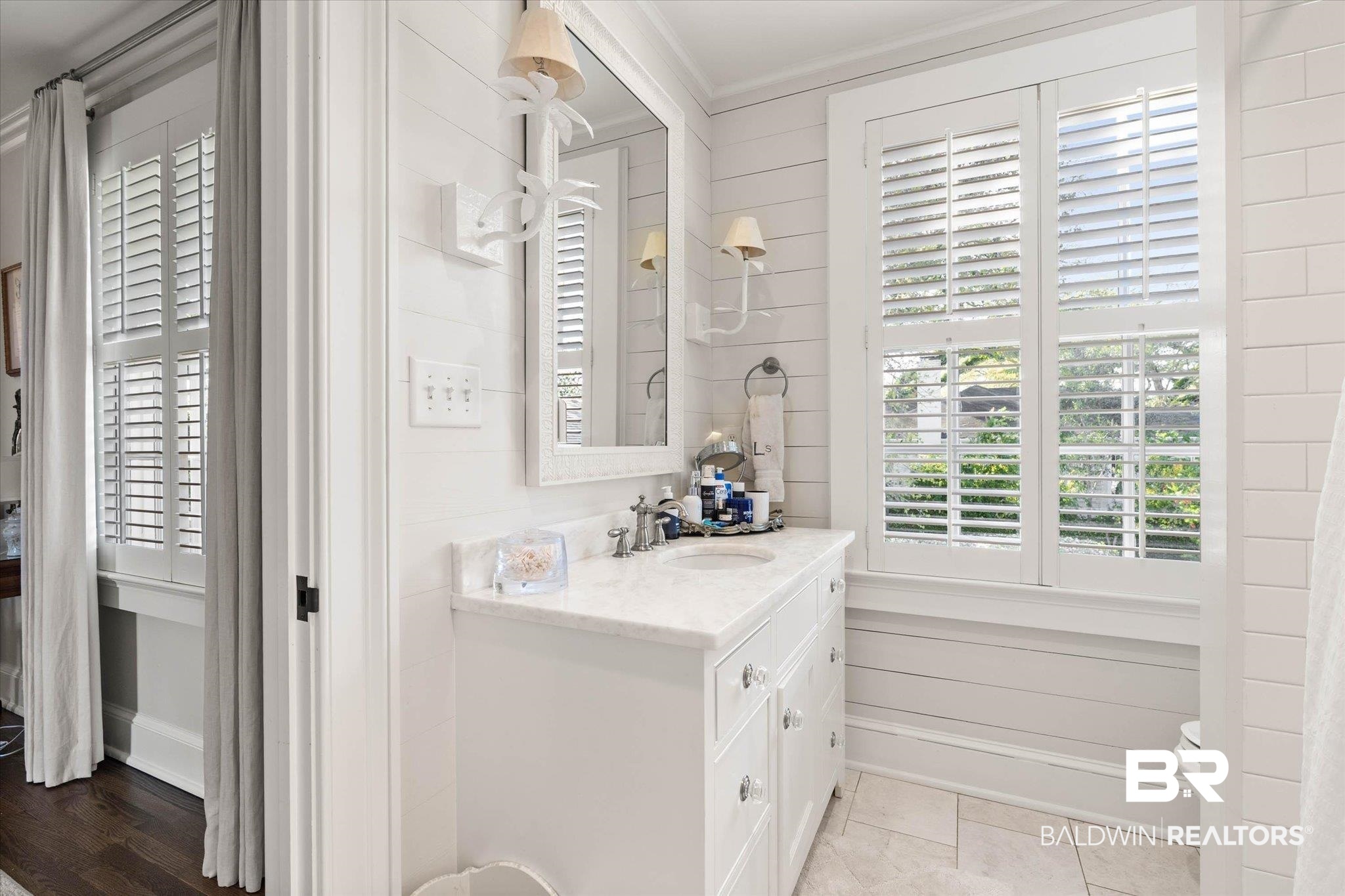 2256 De Leon Avenue Mobile, AL 36607 - Photo 34 of 61 Bathroom with vanity, ornamental molding, and wood walls
