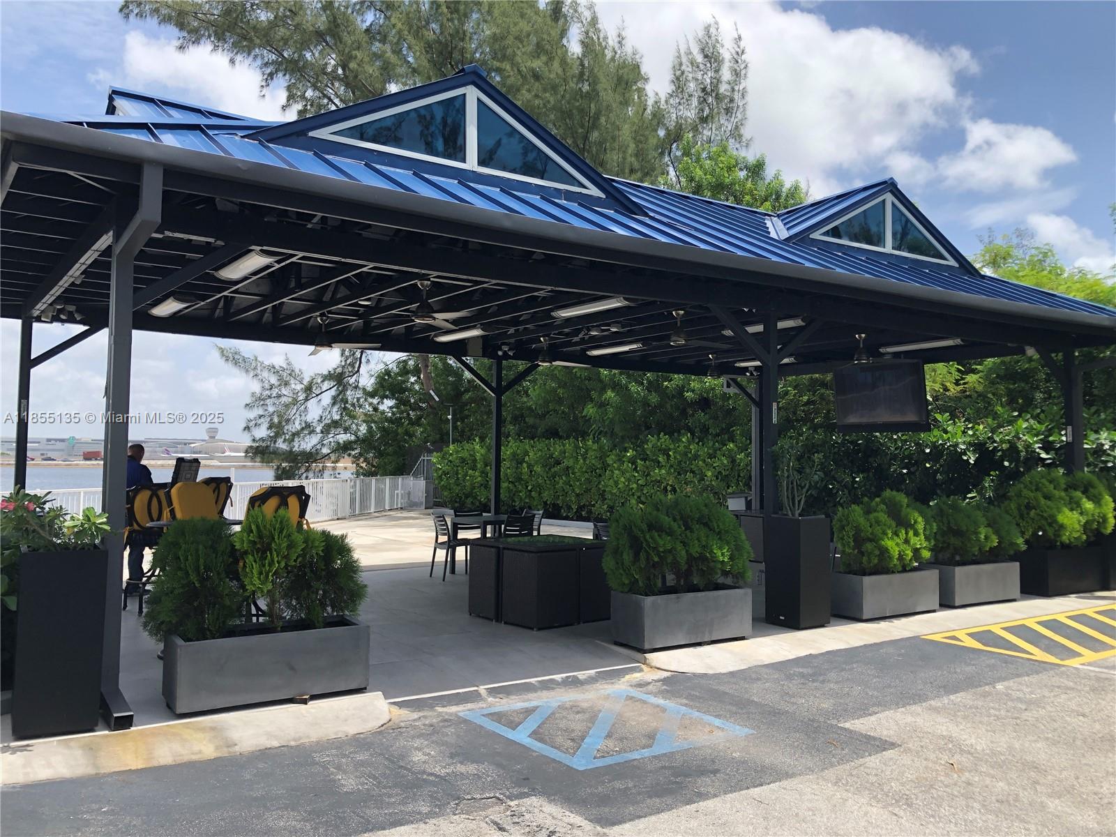 5077 Northwest 7th Street, Unit PH4 Miami, FL 33126 - Photo 11 of 25 a view of a patio