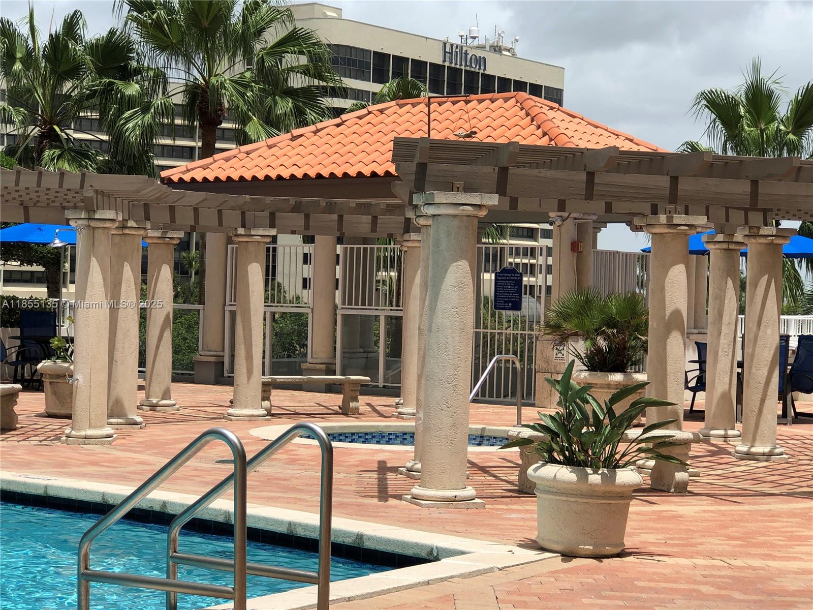 5077 Northwest 7th Street, Unit PH4 Miami, FL 33126 - Photo 18 of 25 a view of a cafe with sitting area