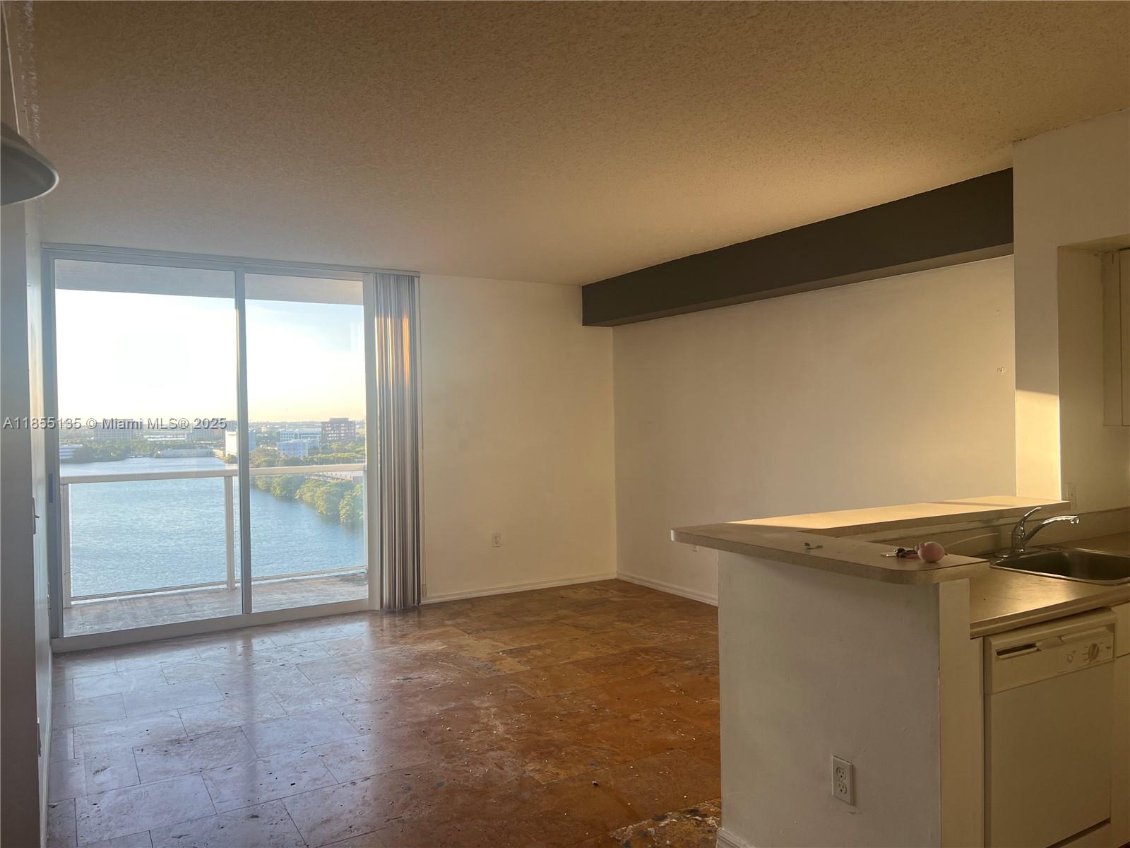 5077 Northwest 7th Street, Unit PH4 Miami, FL 33126 - Photo 25 of 25 a view of an empty room and window