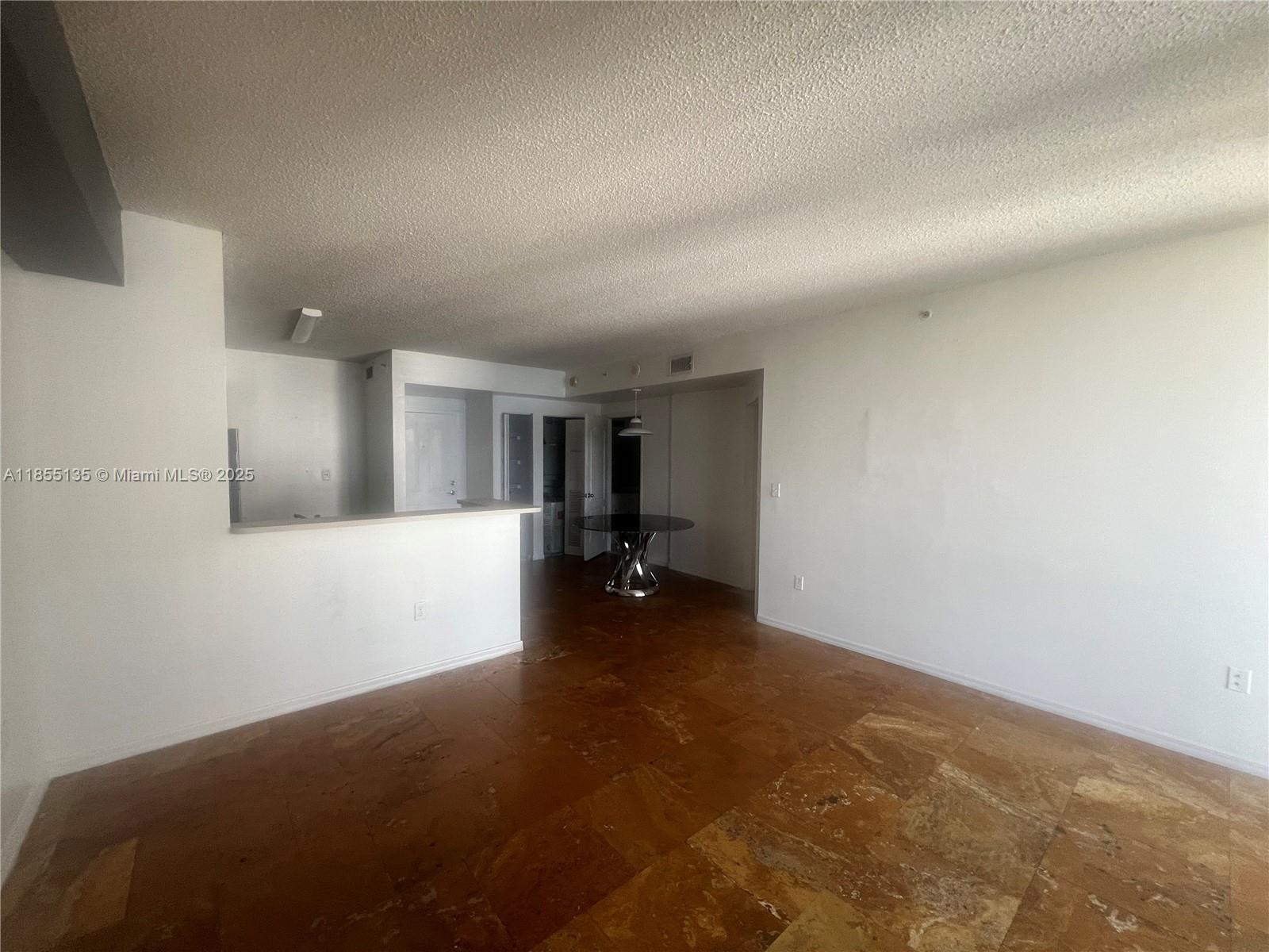 5077 Northwest 7th Street, Unit PH4 Miami, FL 33126 - Photo 8 of 25 a view of empty room