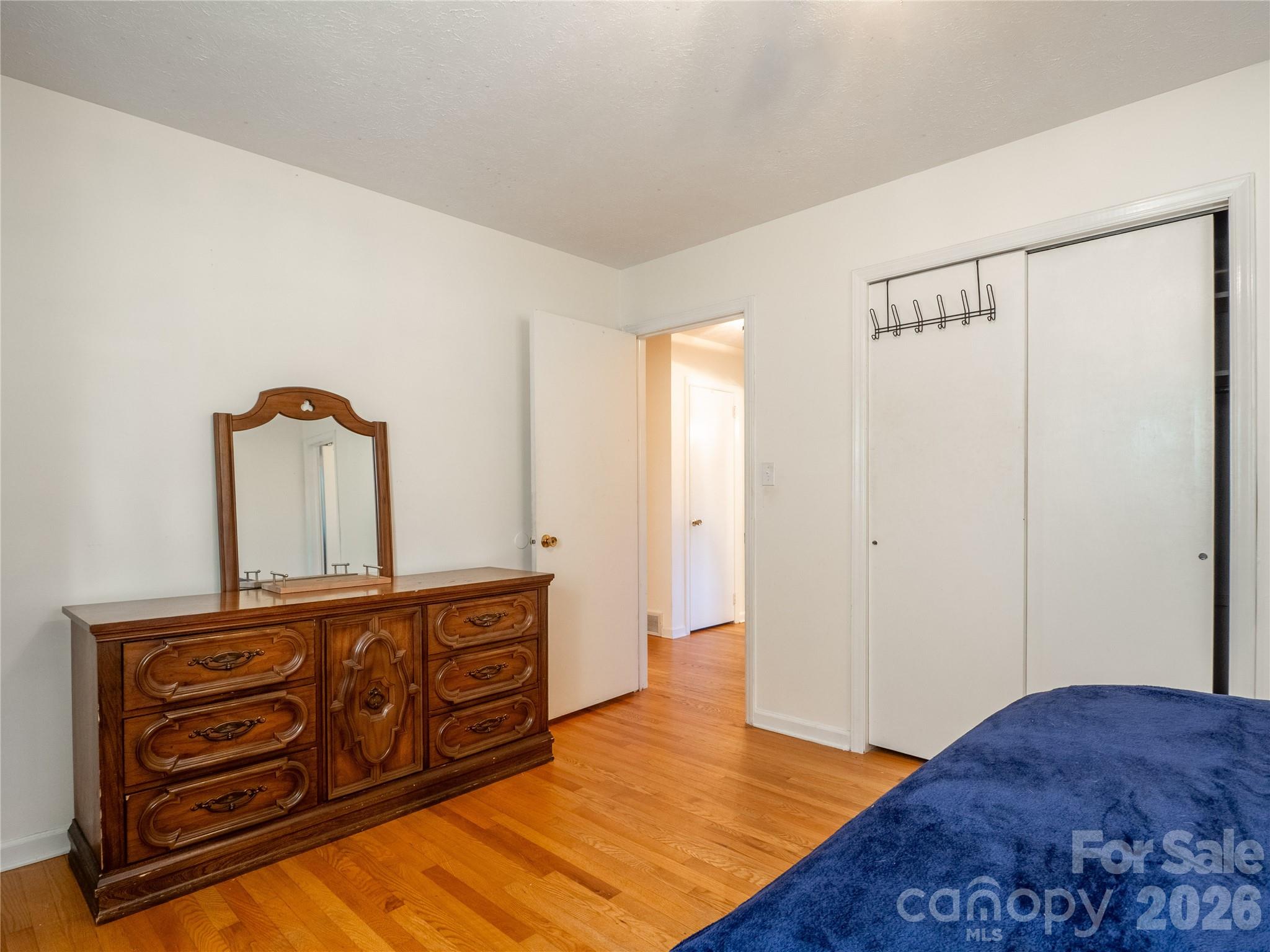 203 Oak Grove Road East Flat Rock, NC 28726 - Photo 13 of 24 a bedroom with a bed and cabinets