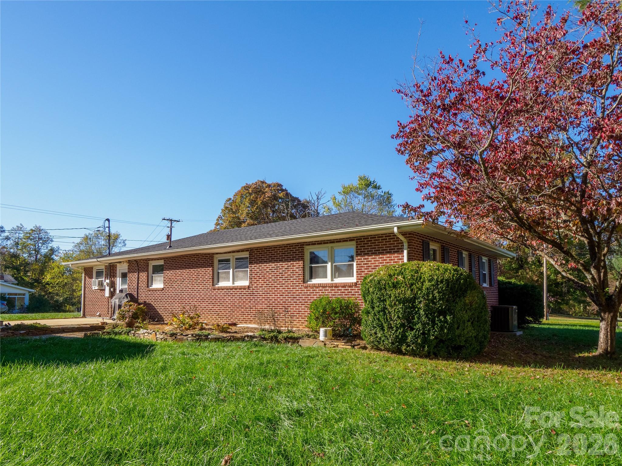 203 Oak Grove Road East Flat Rock, NC 28726 - Photo 17 of 24 a view of a back yard of the house