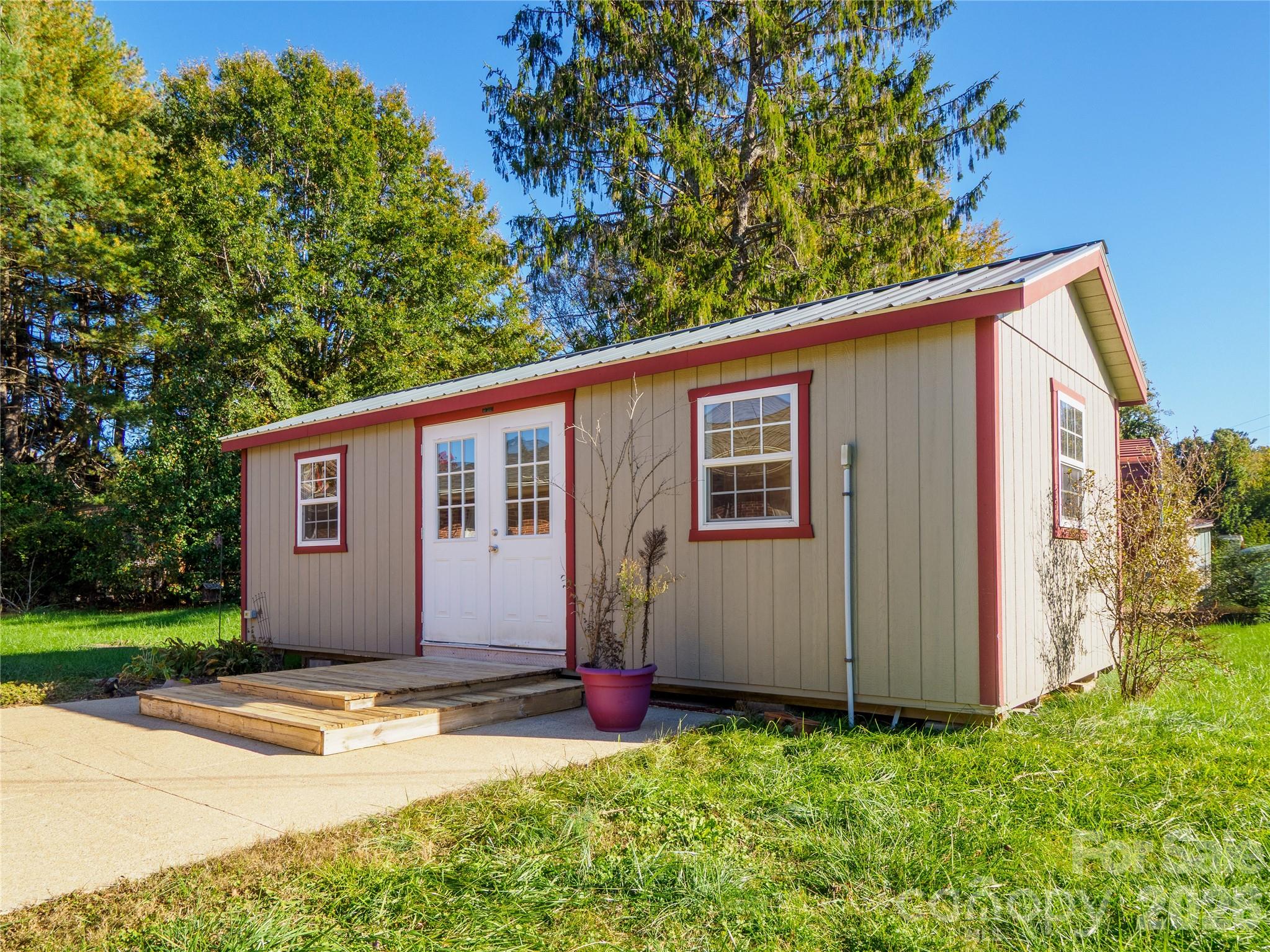 203 Oak Grove Road East Flat Rock, NC 28726 - Photo 19 of 24 a view of a house with backyard and tree