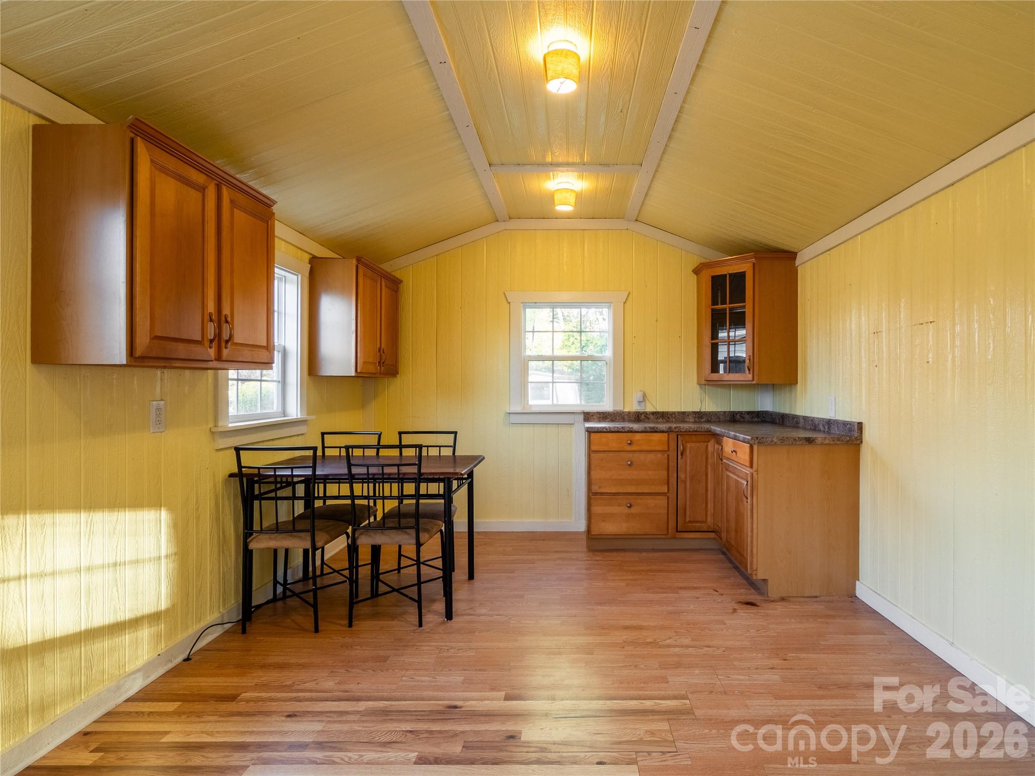 203 Oak Grove Road East Flat Rock, NC 28726 - Photo 20 of 24 a view of a kitchen with kitchen island granite countertop a window and a sink