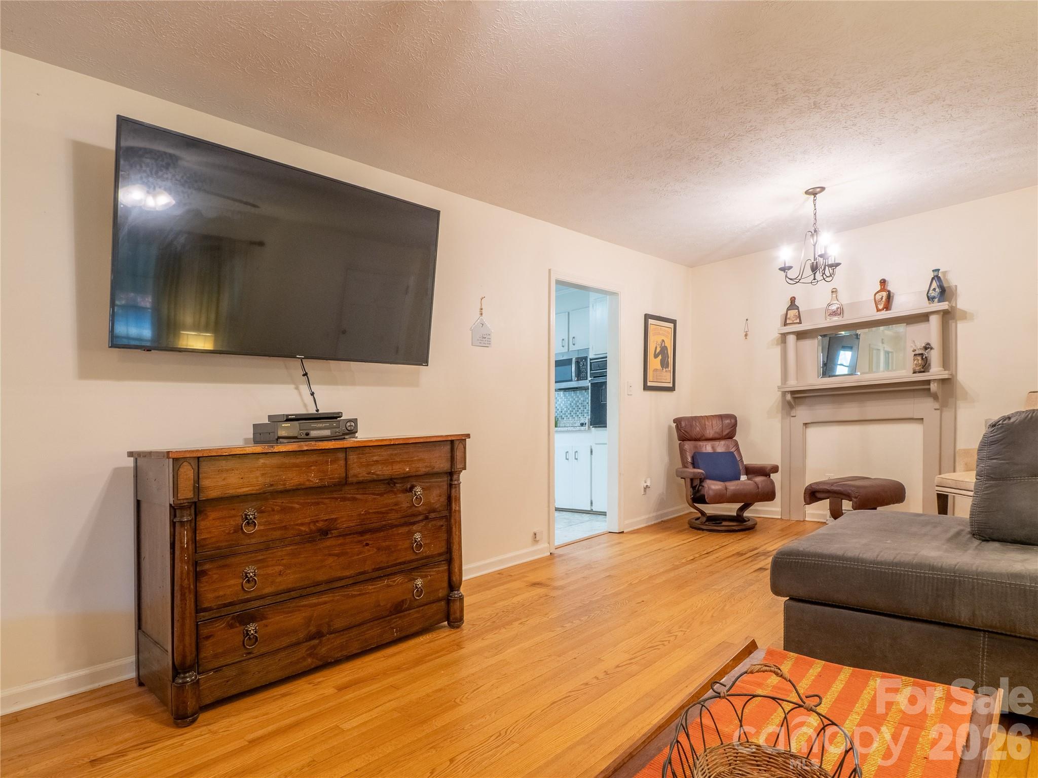 203 Oak Grove Road East Flat Rock, NC 28726 - Photo 5 of 24 a bedroom with a bed and flat screen tv