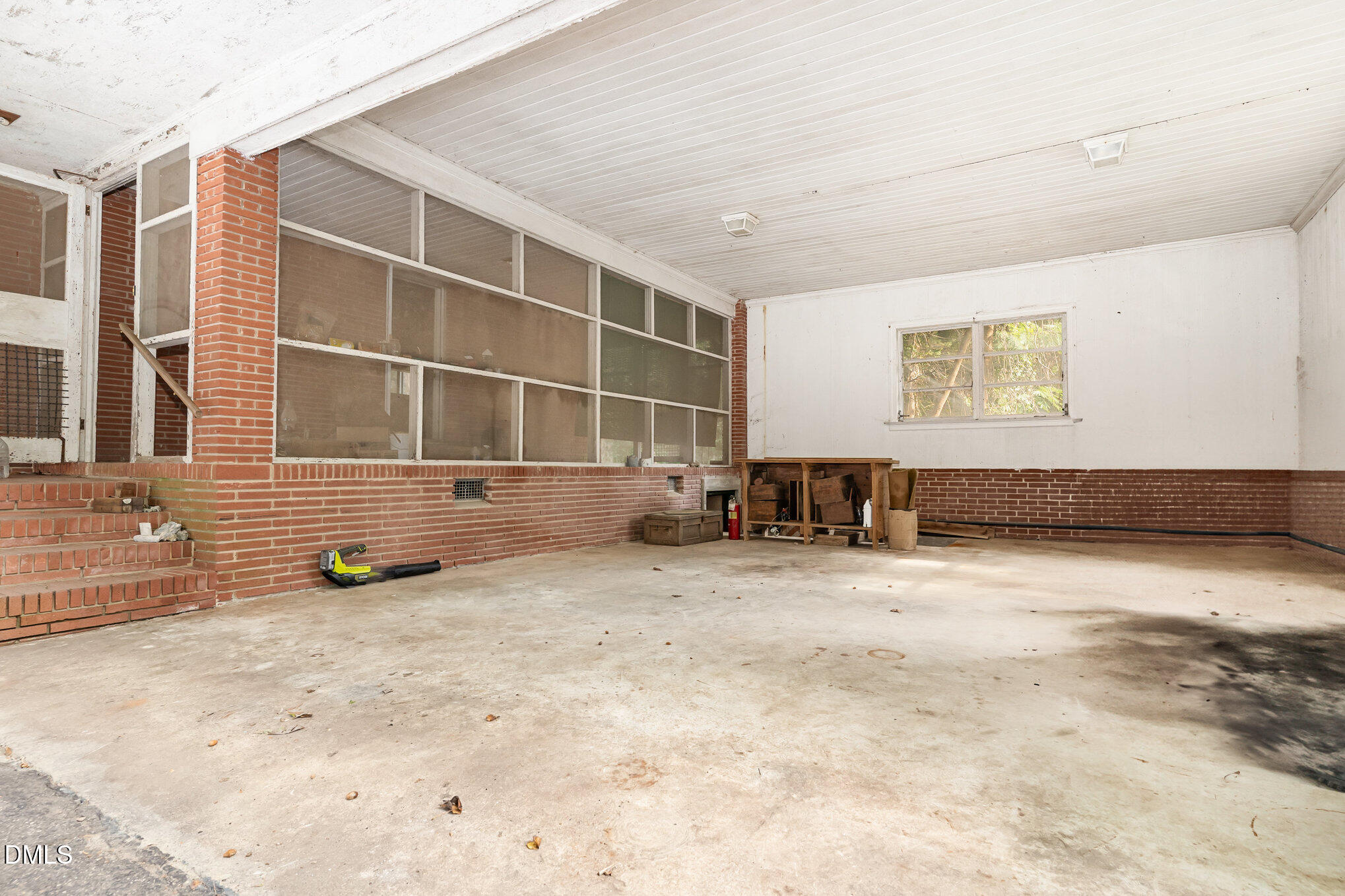 1312 Onslow Road Raleigh, NC 27606 - Photo 18 of 26 a view of an empty room with a window