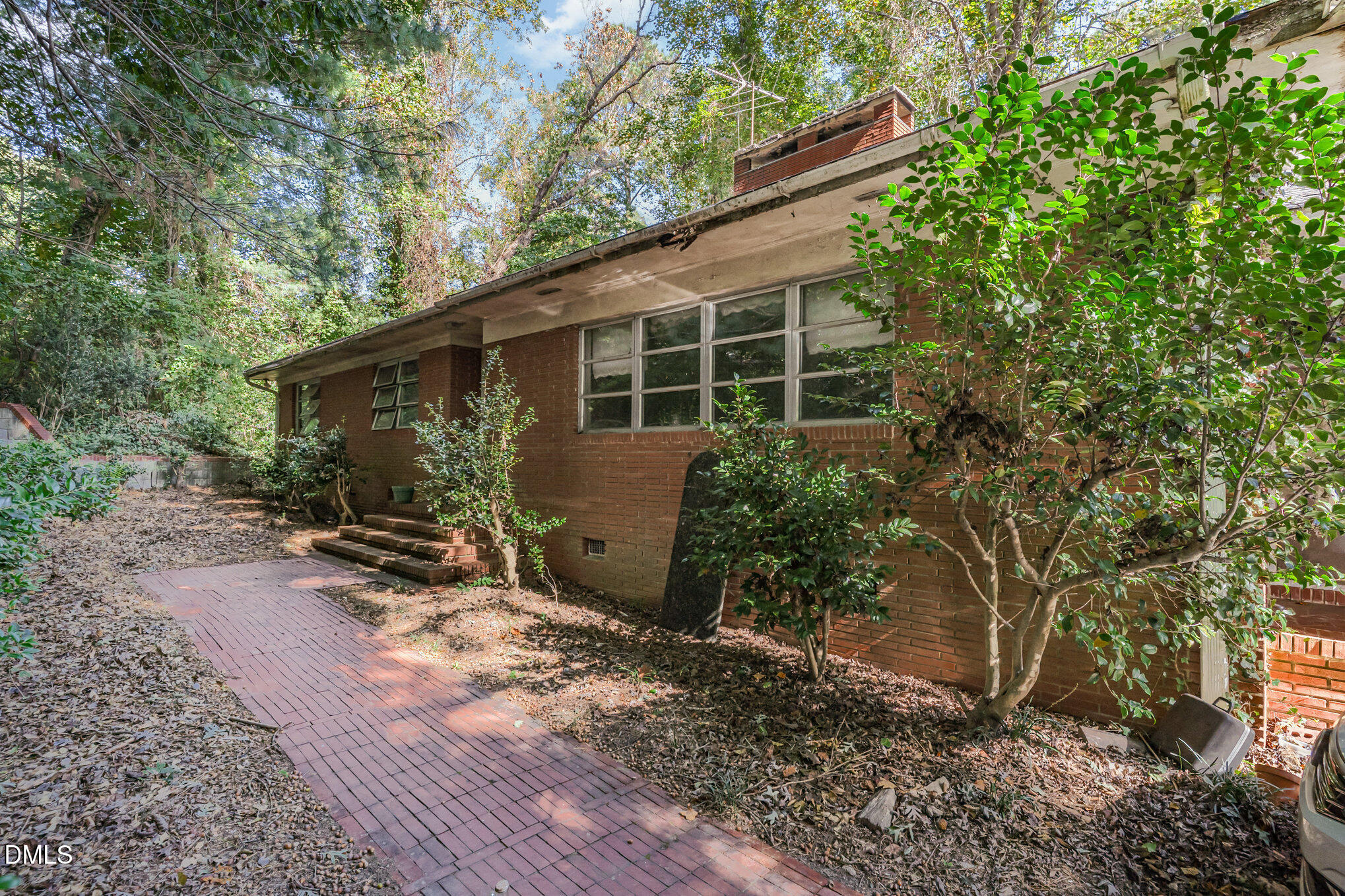 1312 Onslow Road Raleigh, NC 27606 - Photo 2 of 26 a backyard of a house with seating space