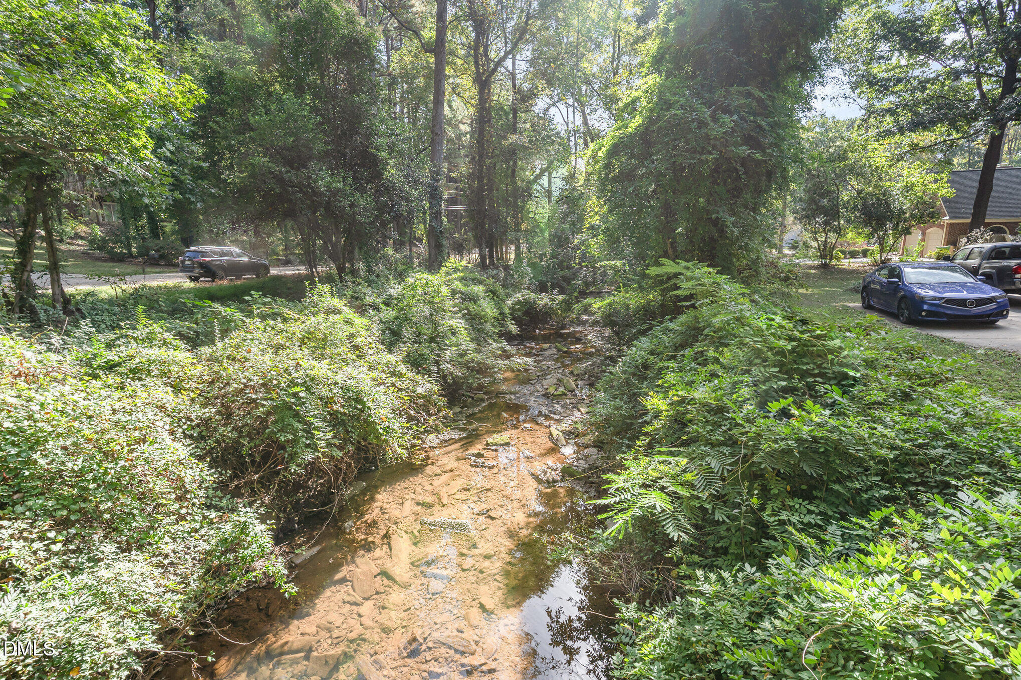 1312 Onslow Road Raleigh, NC 27606 - Photo 25 of 26 a backyard of a house with lots of green space