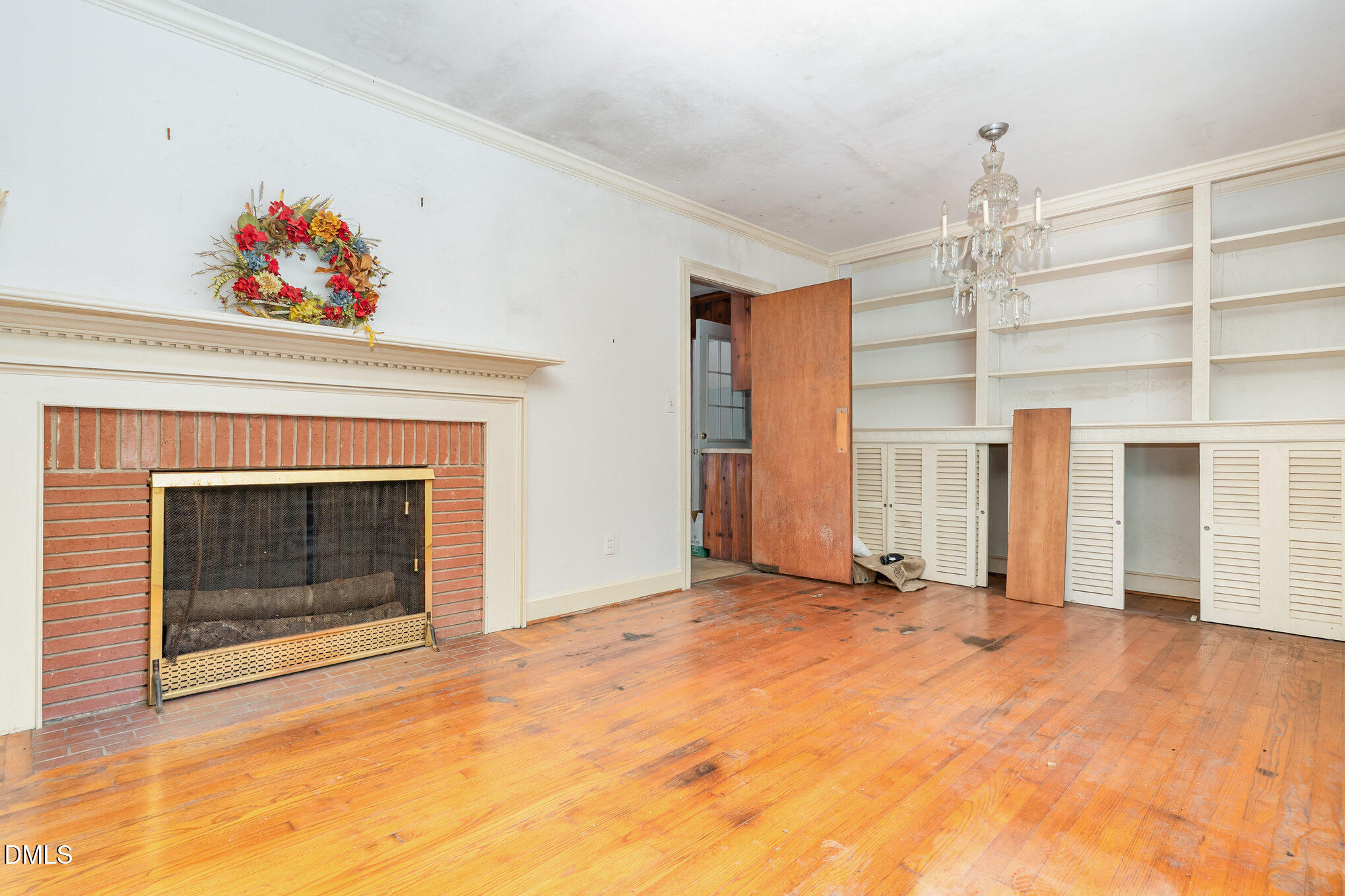 1312 Onslow Road Raleigh, NC 27606 - Photo 6 of 26 a view of an empty room with a fireplace