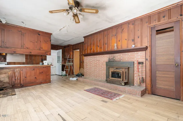 a view of a kitchen with furniture and a fireplace